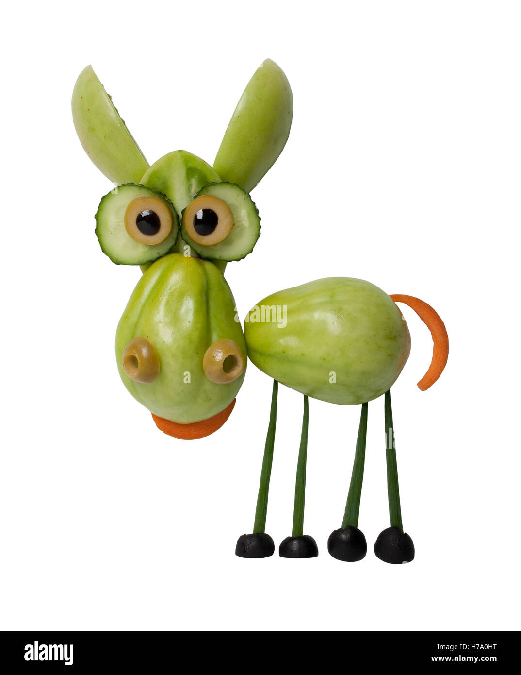 Funny donkey made of green tomato on white background Stock Photo Alamy