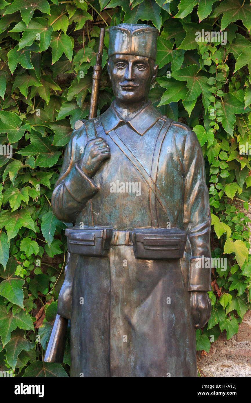 Statue of a World War II partisan soldier guarding the entrance of the Ruzica Church in Belgrade, Serbia Stock Photo