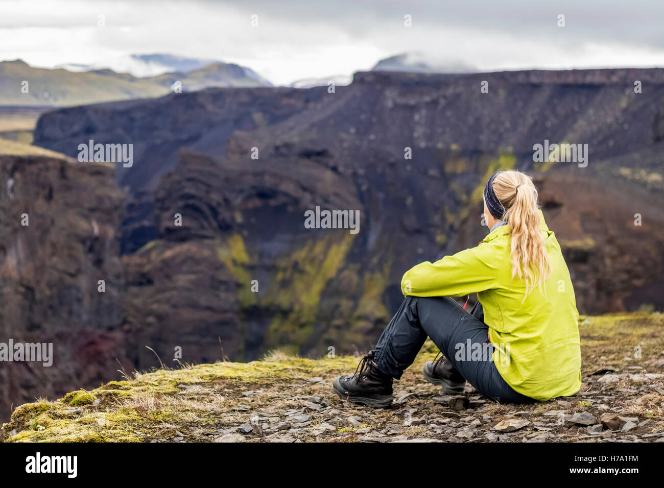 Young woman overlooking the Markarfljótsgljúfur, Markarfljót canyon Stock Photo