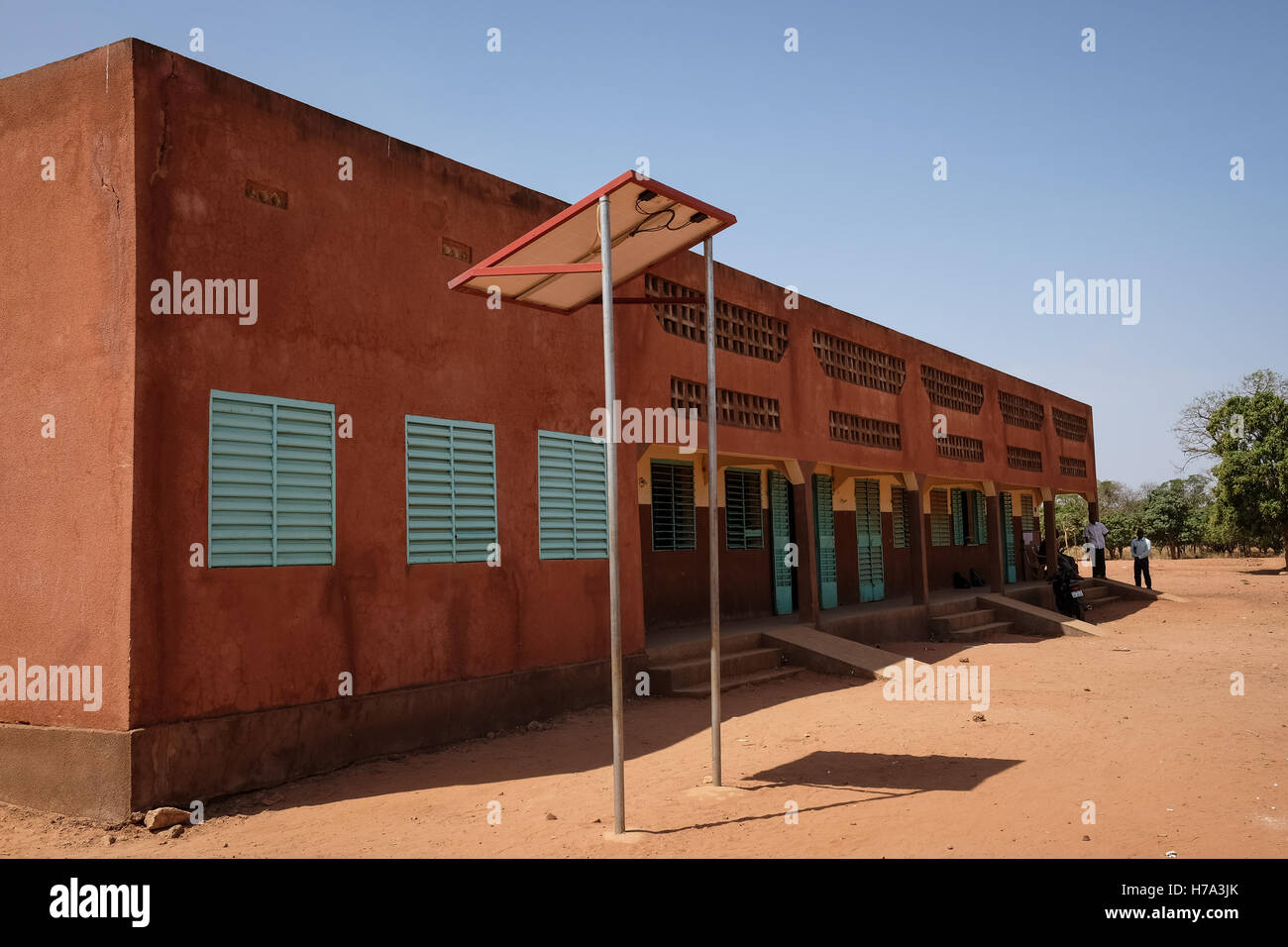 Rural electrification and solar energy in sub-Saharan Africa. -  10/03/2016  -    -  Samogohiri, Kenegoudou (Burkina), March 10th, 2016: Middle school and high school of Samogohiri. Two solar pannels are used for the electricity in classrooms. Mr Kambore, a middle school teacher for a class of 74 pupils.   -  Nicolas Remene / Le Pictorium Stock Photo