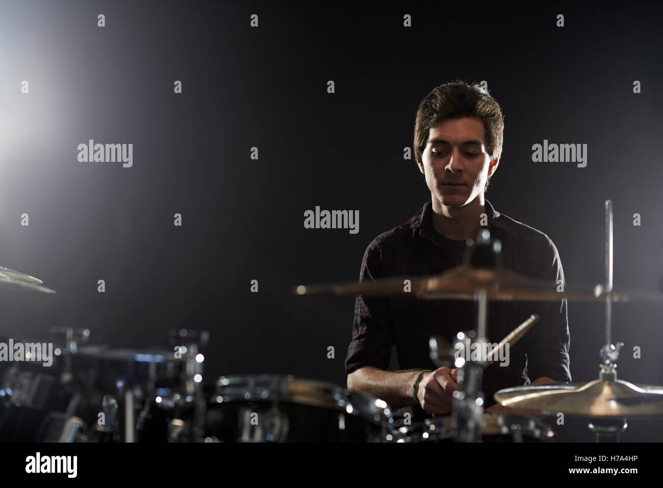 Young Drummer Playing Drum Kit In Studio Stock Photo - Alamy