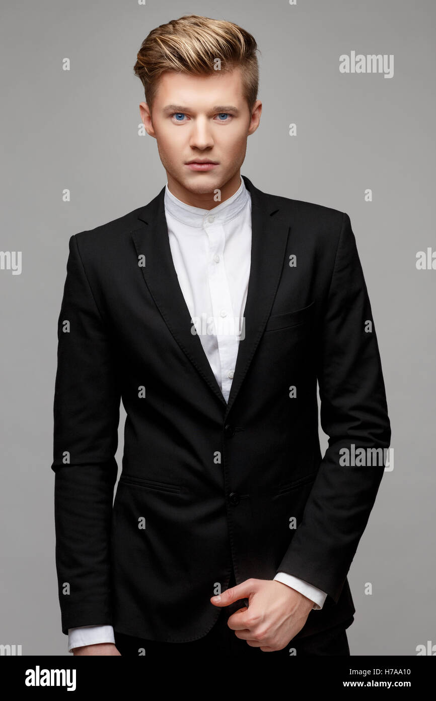 Portrait of a young handsome business man Stock Photo - Alamy