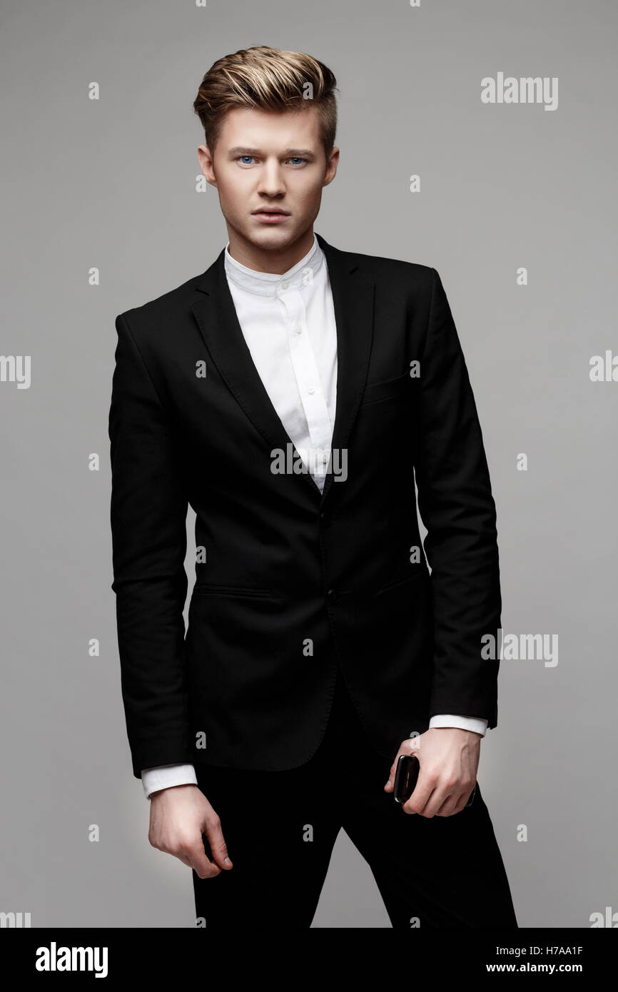 Portrait of a young handsome business man Stock Photo - Alamy