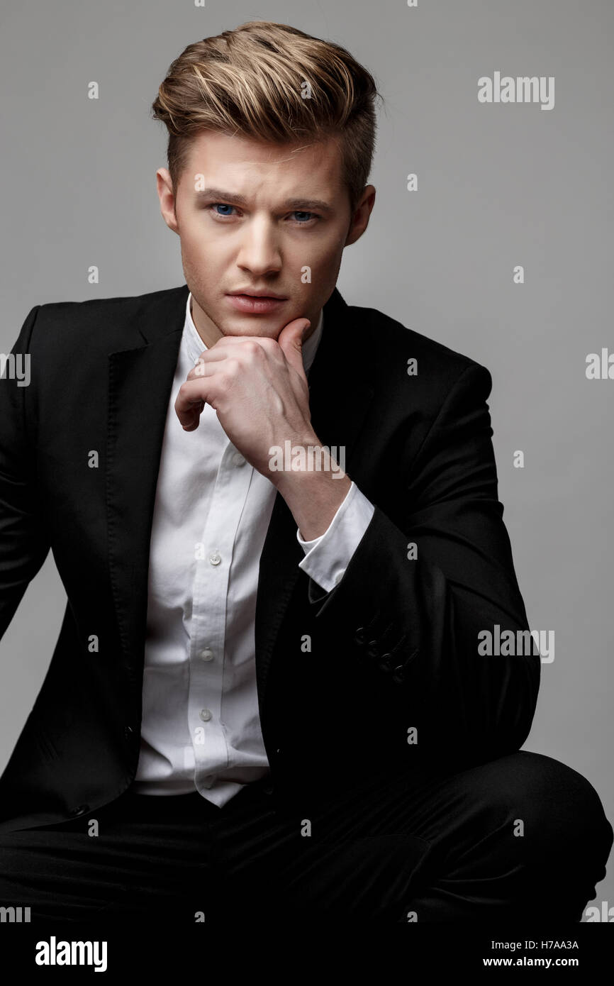 Portrait of a young handsome business man Stock Photo - Alamy