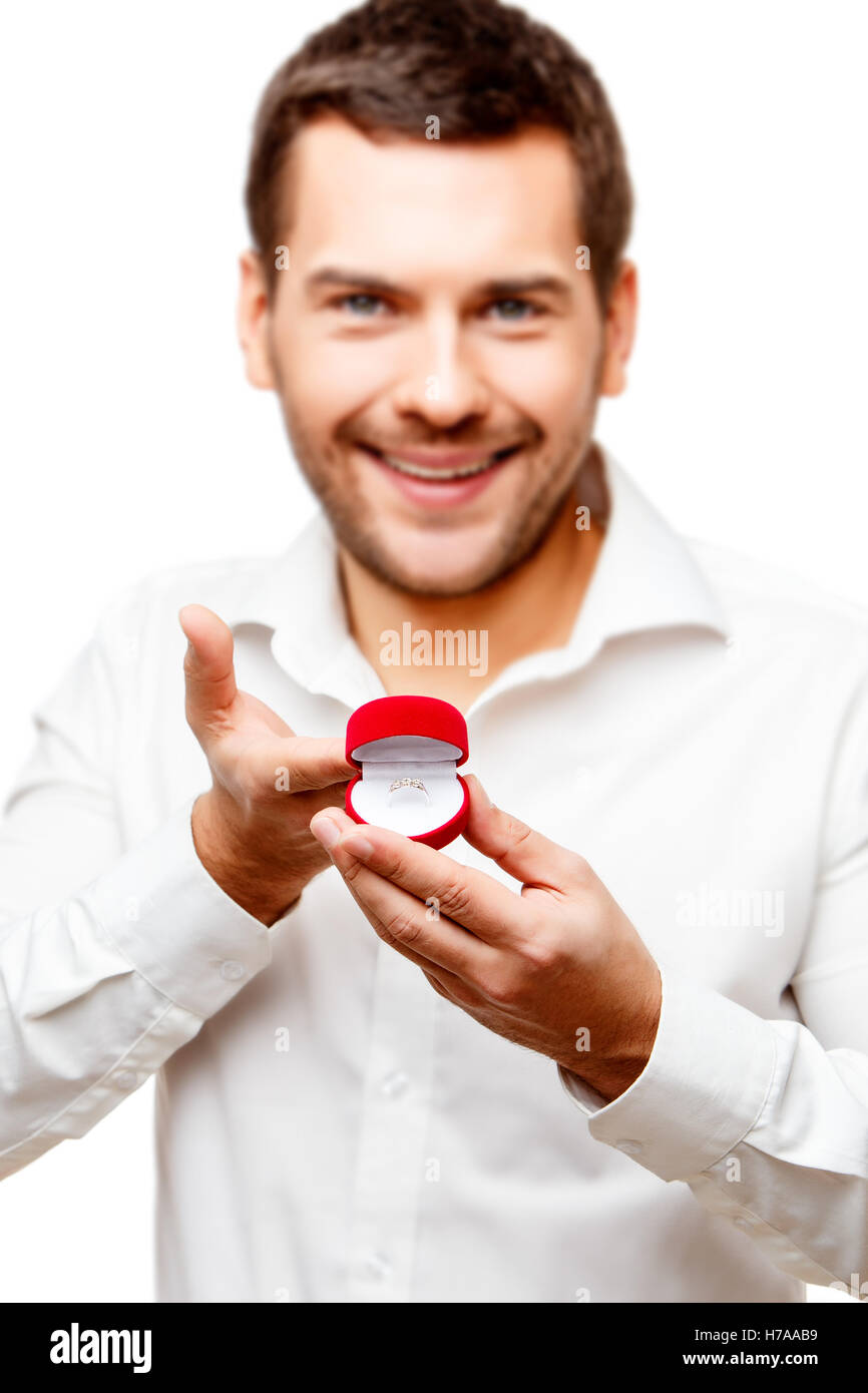 Young man presenting something in a small box Stock Photo