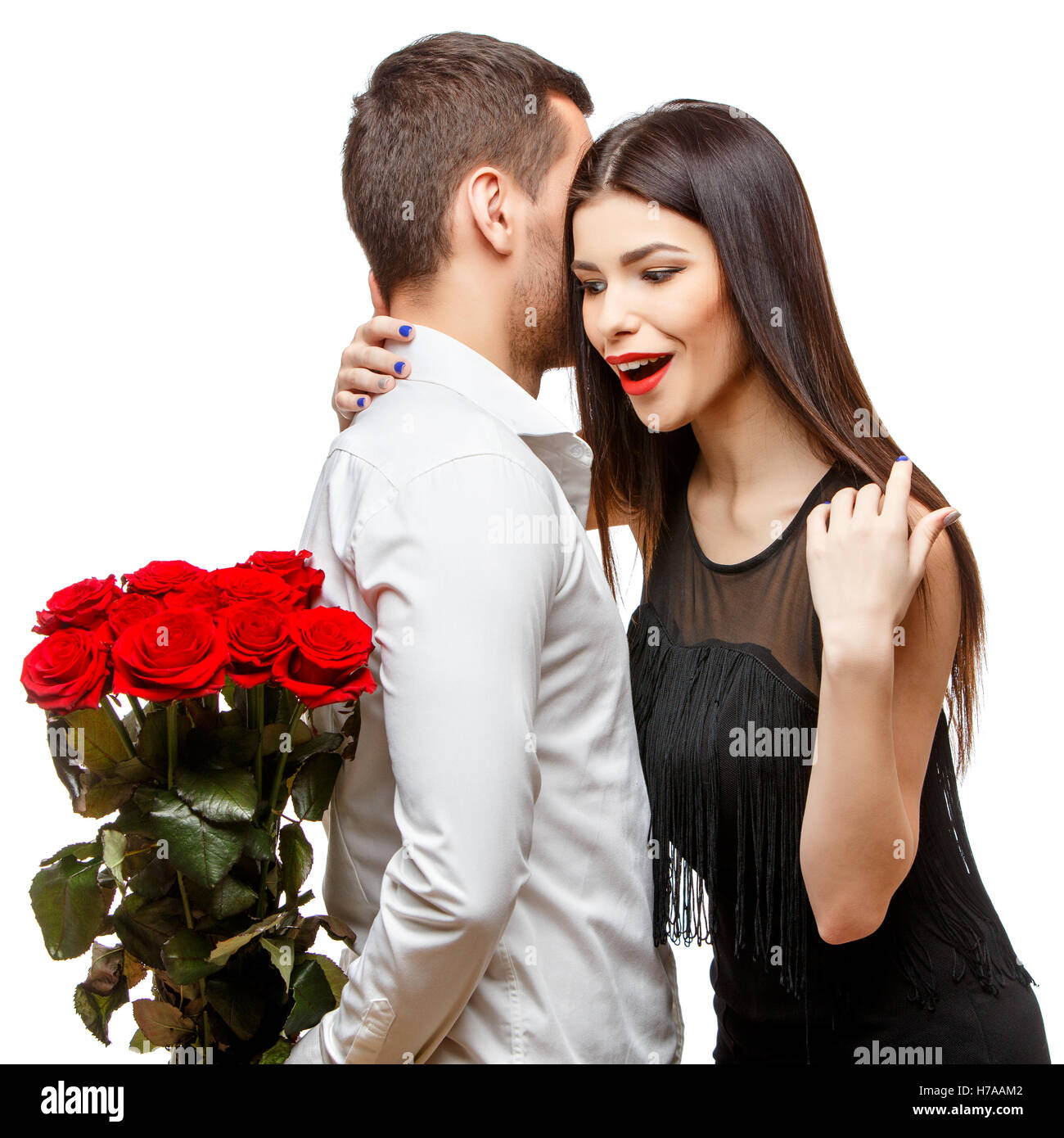 Young beautiful couple with flowers isolated on white Stock Photo - Alamy