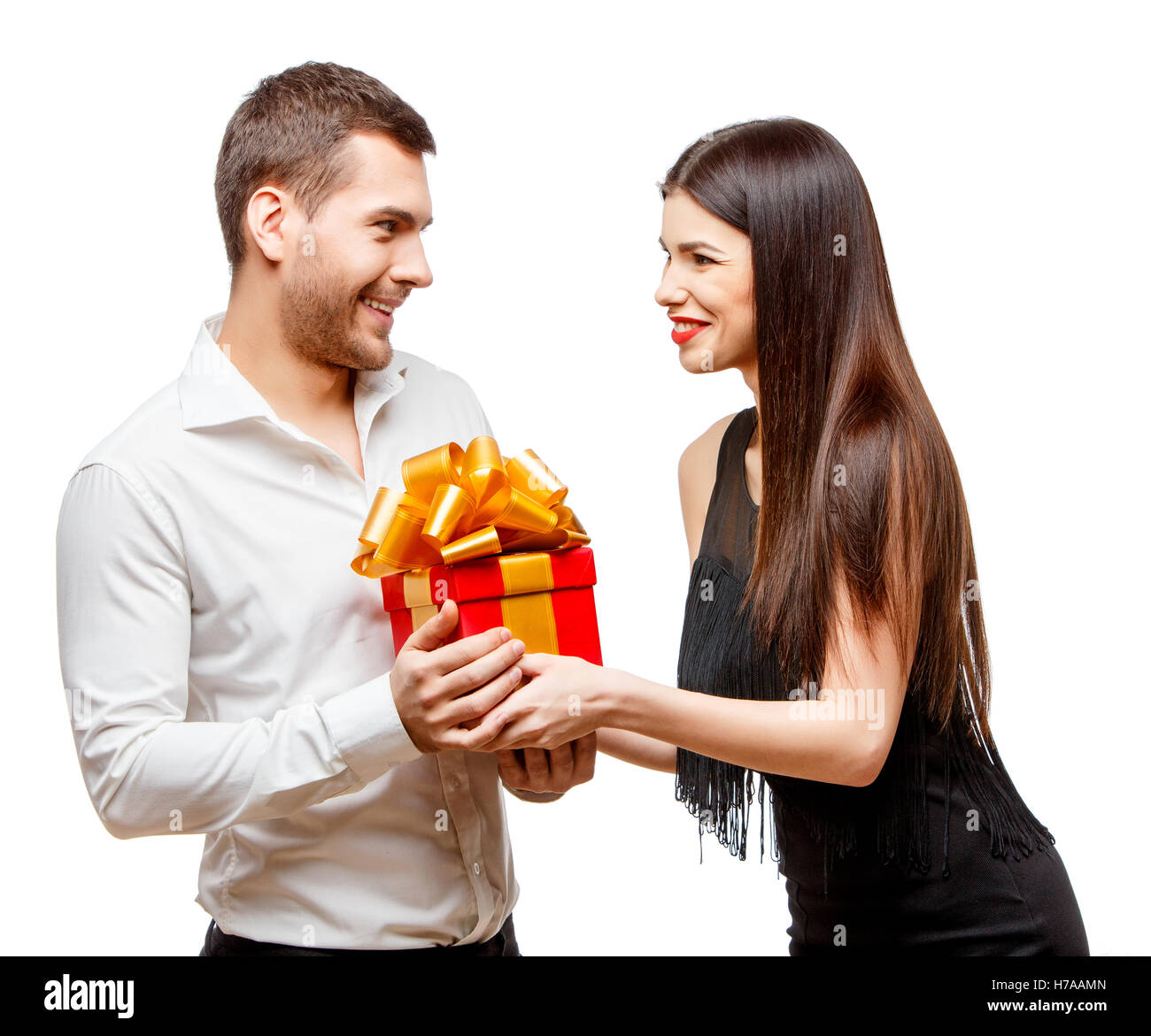 Present Partner Young beautiful couple with present isolated on white Stock Photo - Alamy