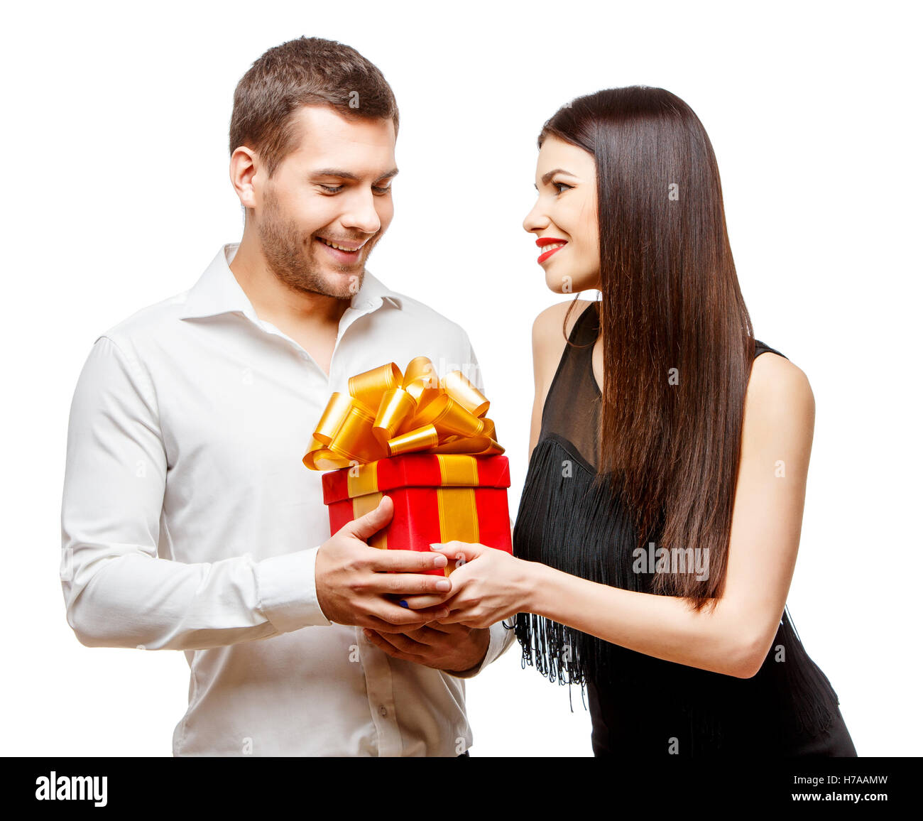 Present Partner Young beautiful couple with present isolated on white Stock Photo - Alamy