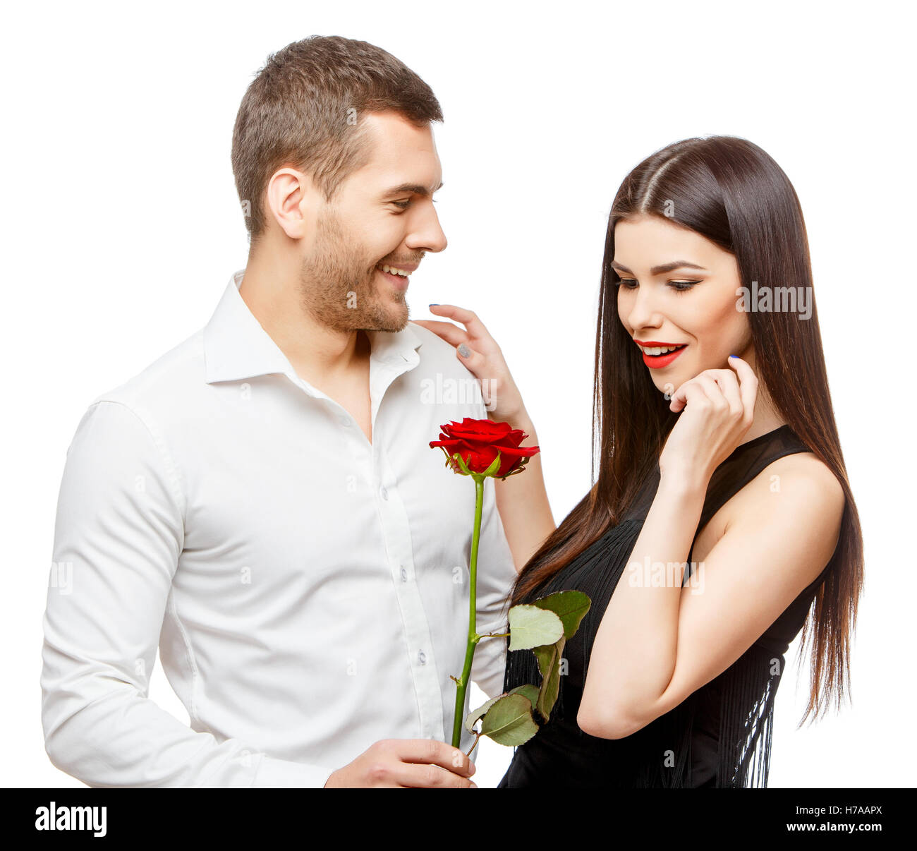 Young beautiful couple with flowers isolated on white Stock Photo - Alamy