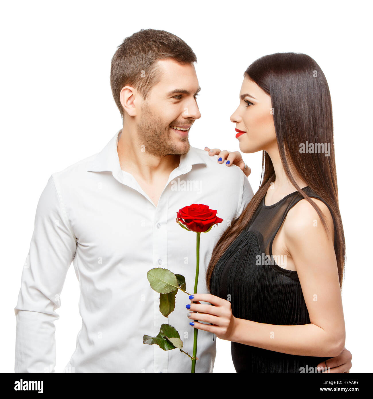 Young beautiful couple with flowers isolated on white Stock Photo - Alamy