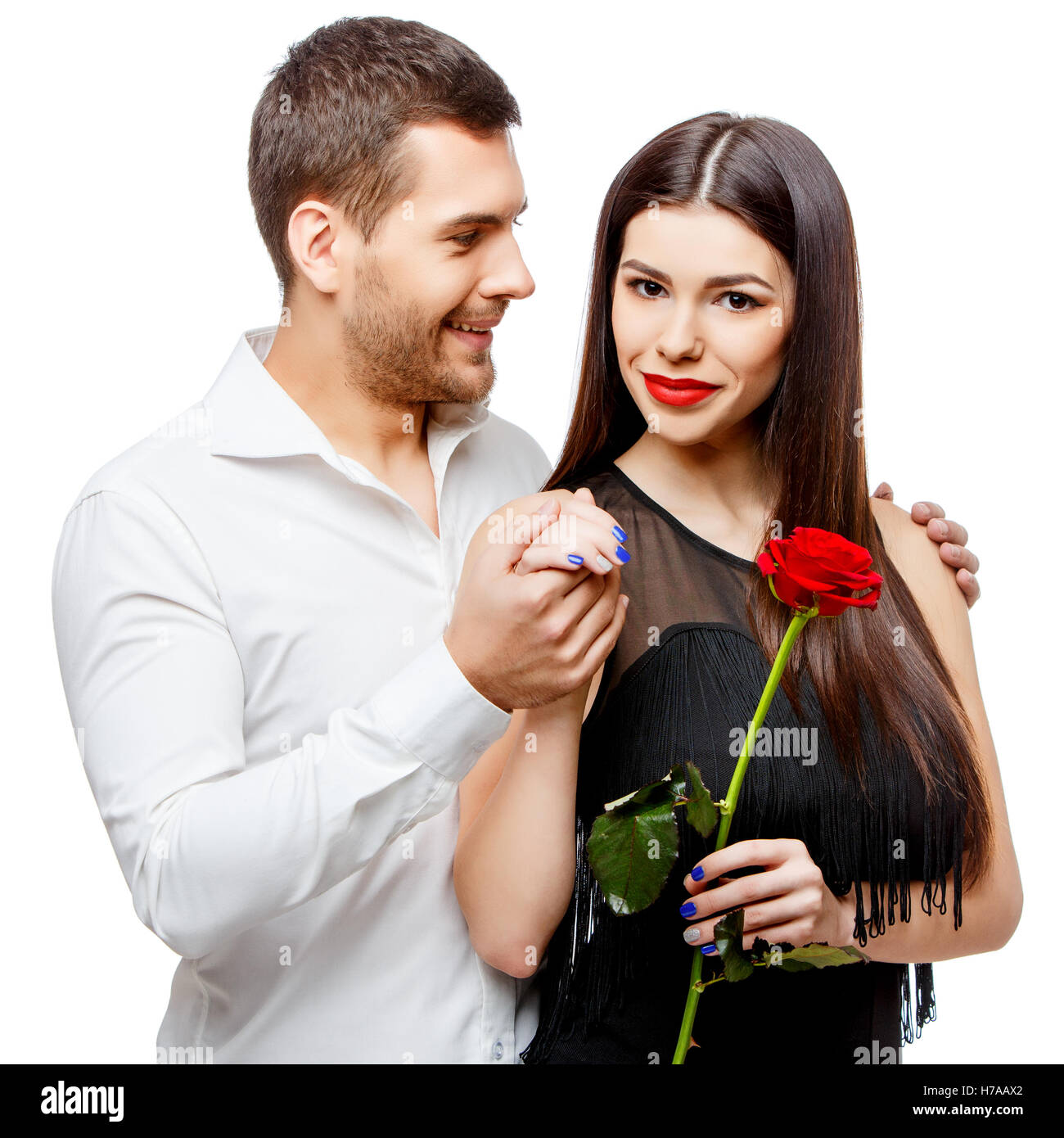 Young beautiful couple with flowers isolated on white Stock Photo - Alamy