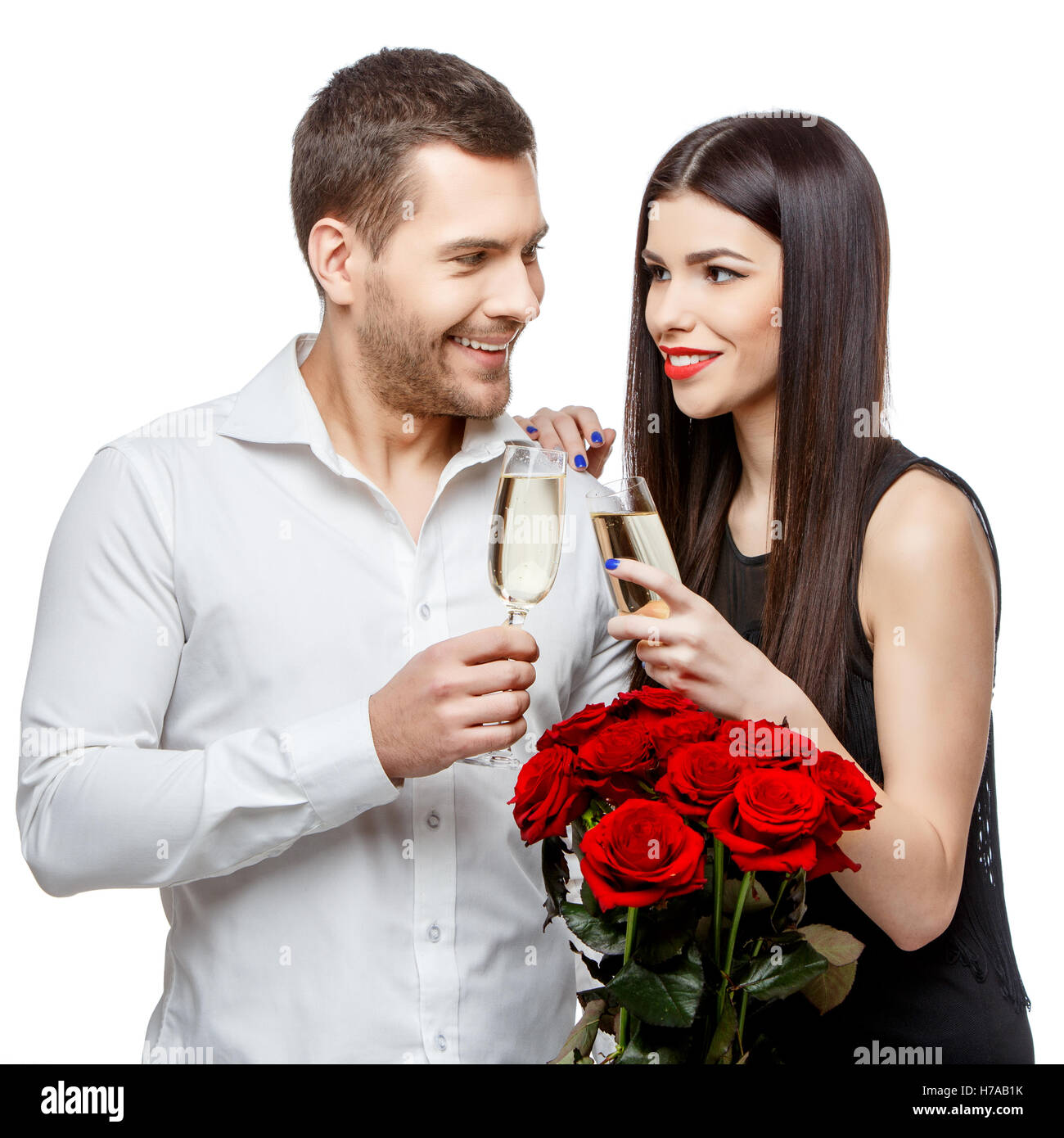 Young beautiful couple with flowers isolated on white Stock Photo - Alamy