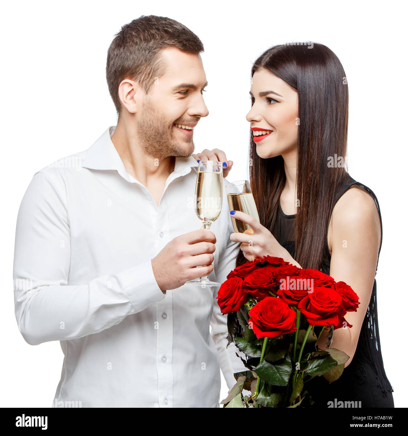Young beautiful couple with flowers isolated on white Stock Photo - Alamy