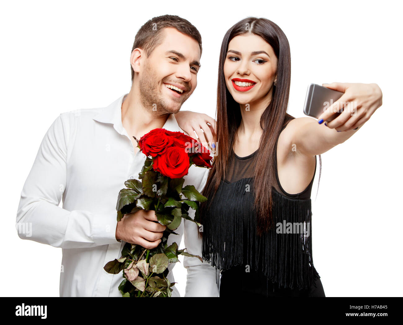 Young beautiful couple with flowers isolated on white Stock Photo - Alamy
