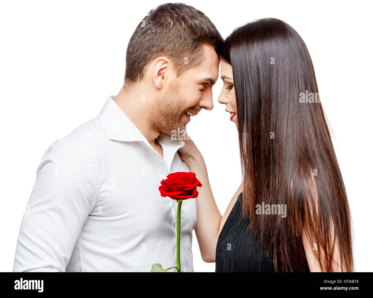 Young beautiful couple with flowers isolated on white Stock Photo - Alamy
