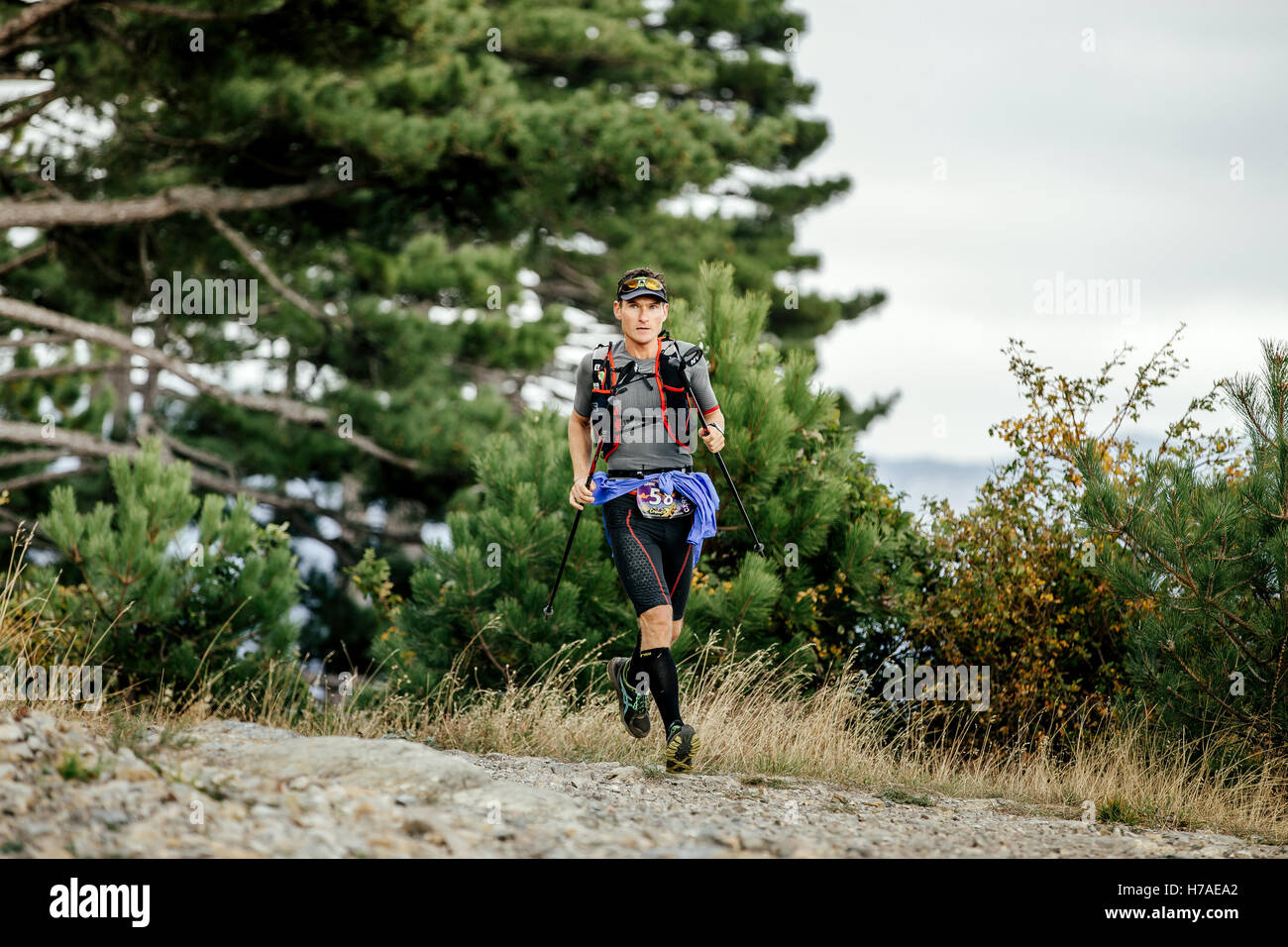 runner skyrunner with nordic hiking running mountain landscape during