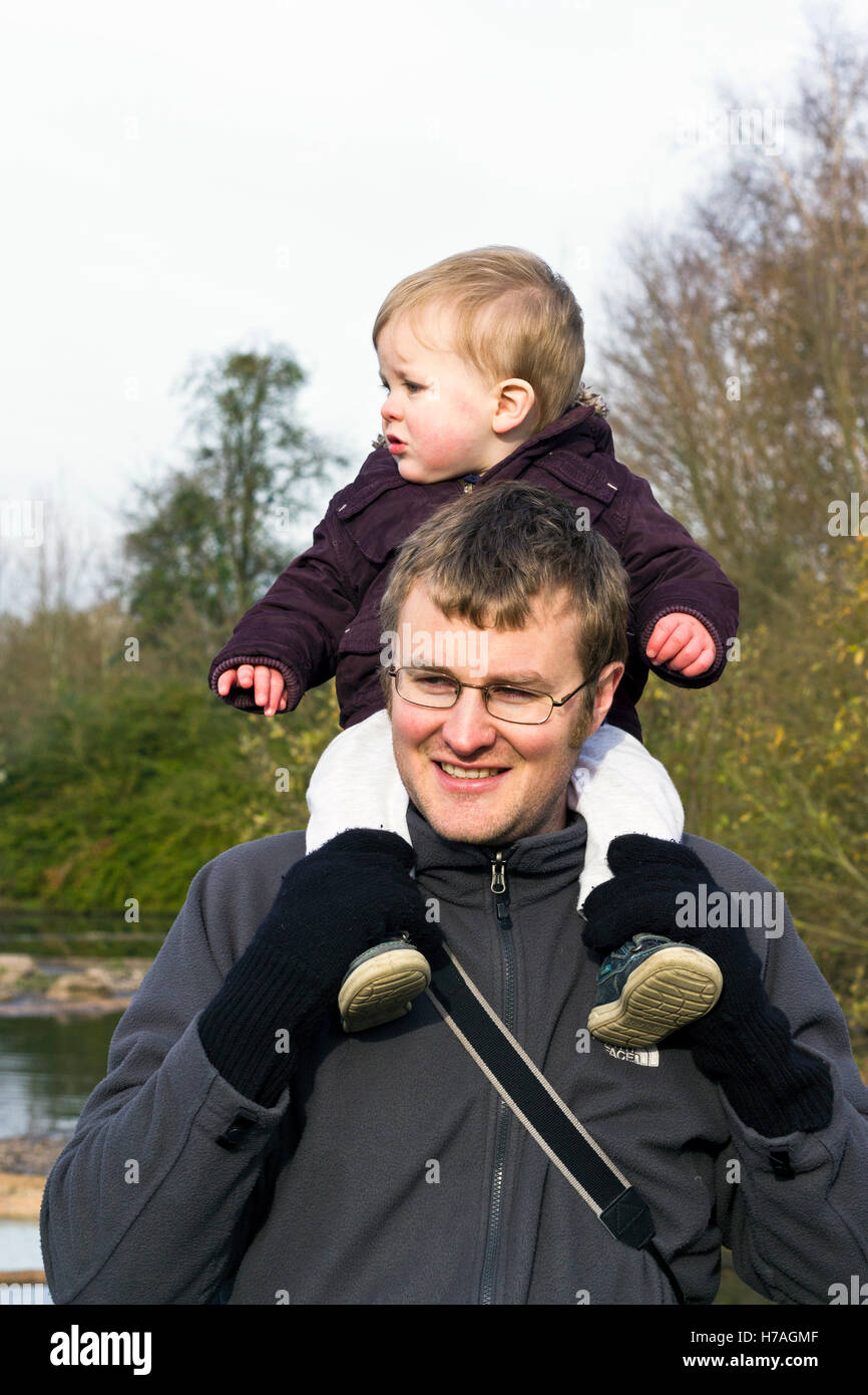 Father carrying son on his shoudlers Stock Photo