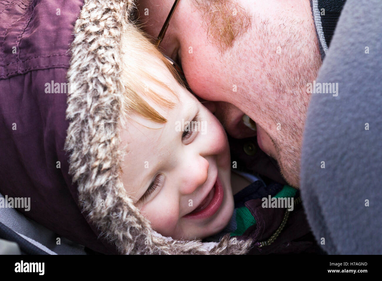 Father making his baby boy laugh Stock Photo