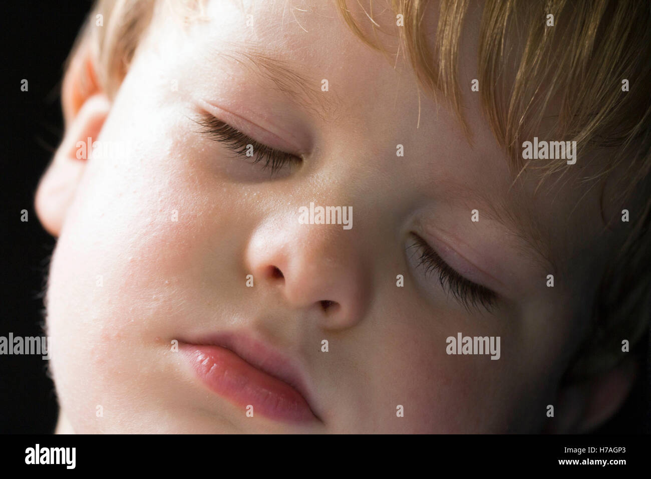 Close-up of young boy sleeping Stock Photo