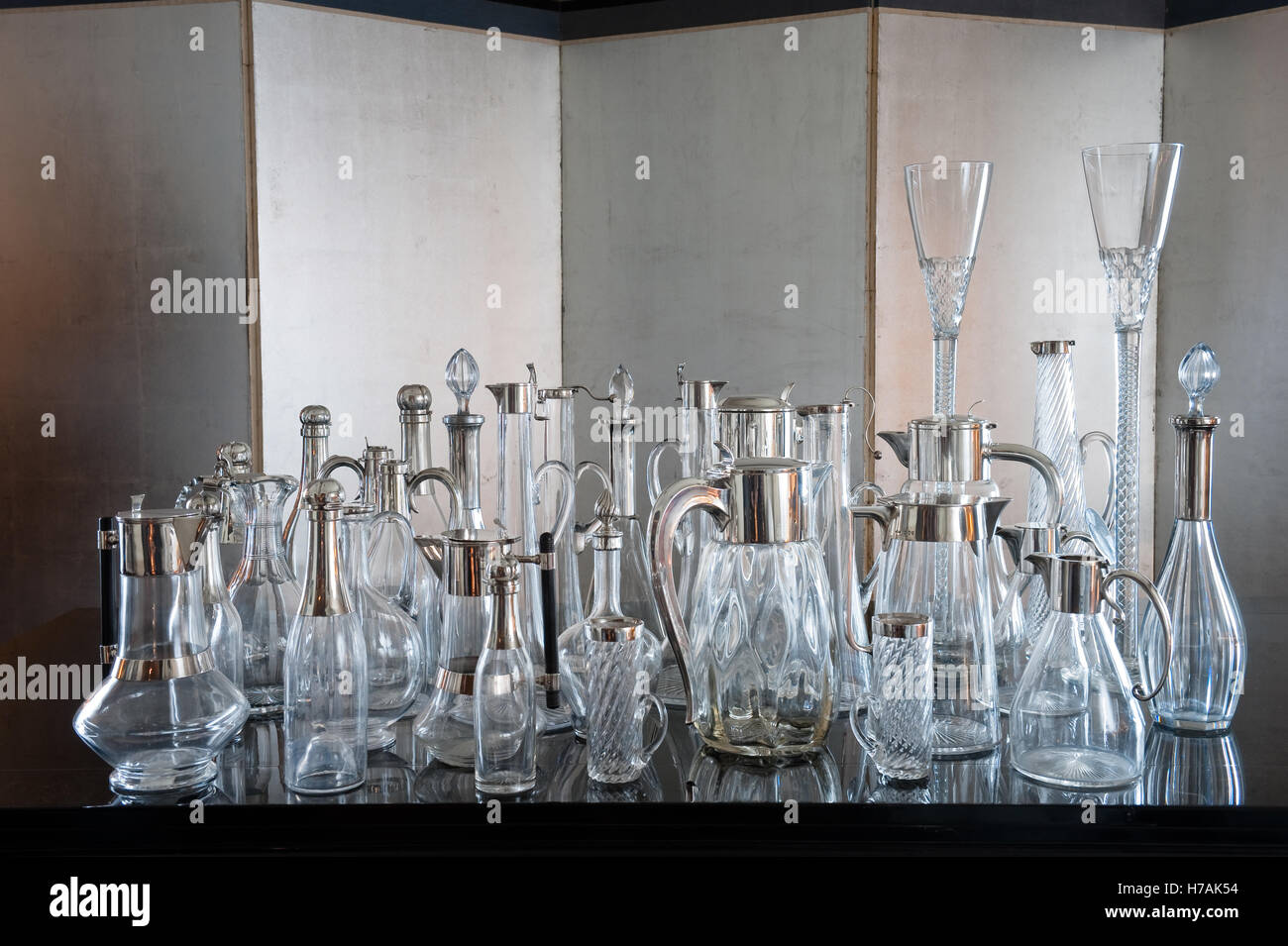 A collection of glass and silver plate decanters Guinevere's antique shop on Kings Road, Chelsea, London, UK Stock Photo
