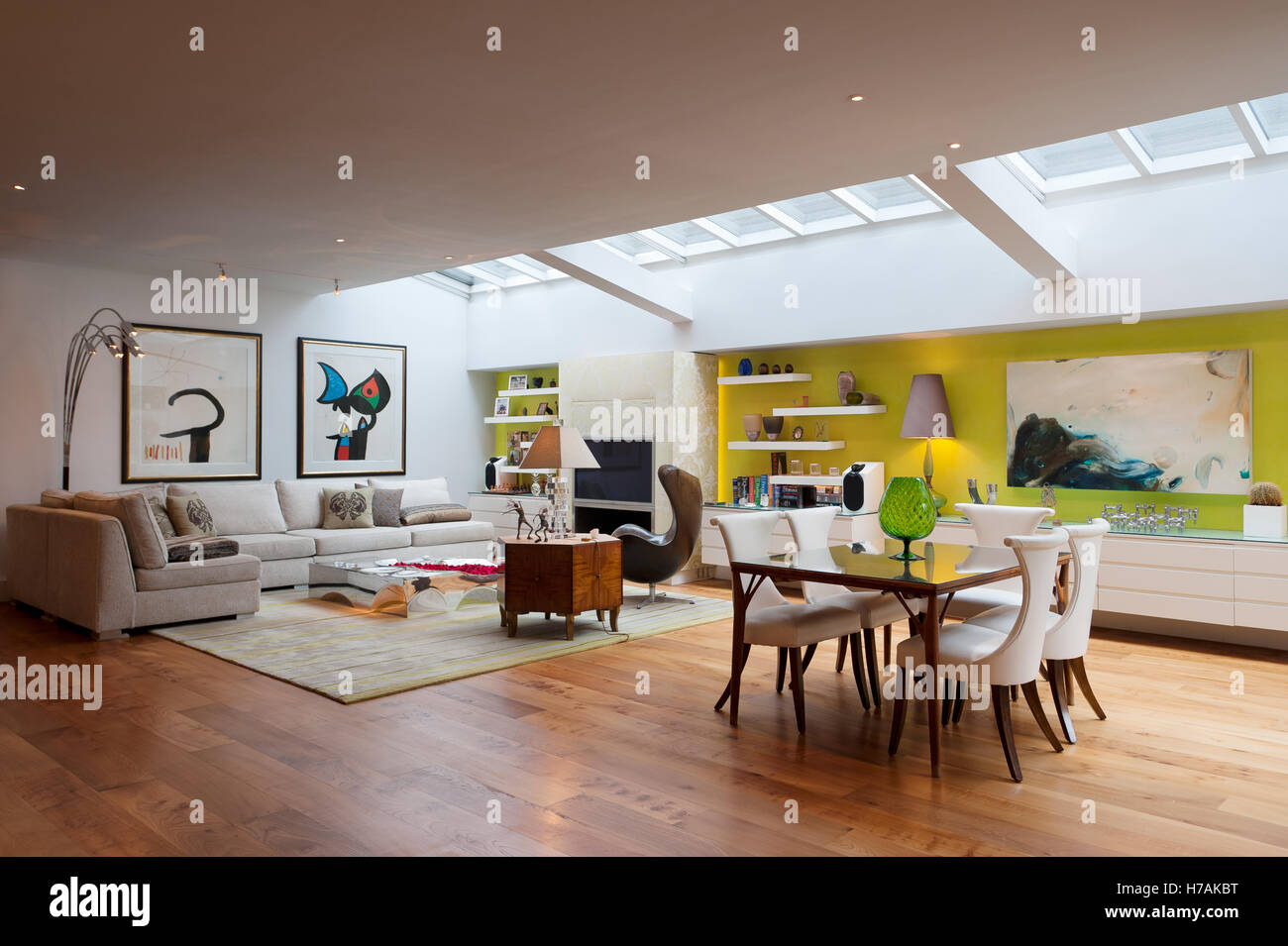 Open plan interior with skylight and Miro prints, interior design UK Stock Photo