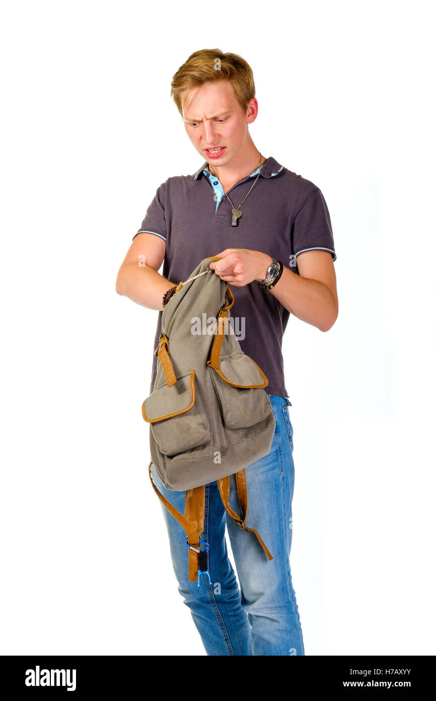 Young man looking for something inside his backpack Stock Photo - Alamy