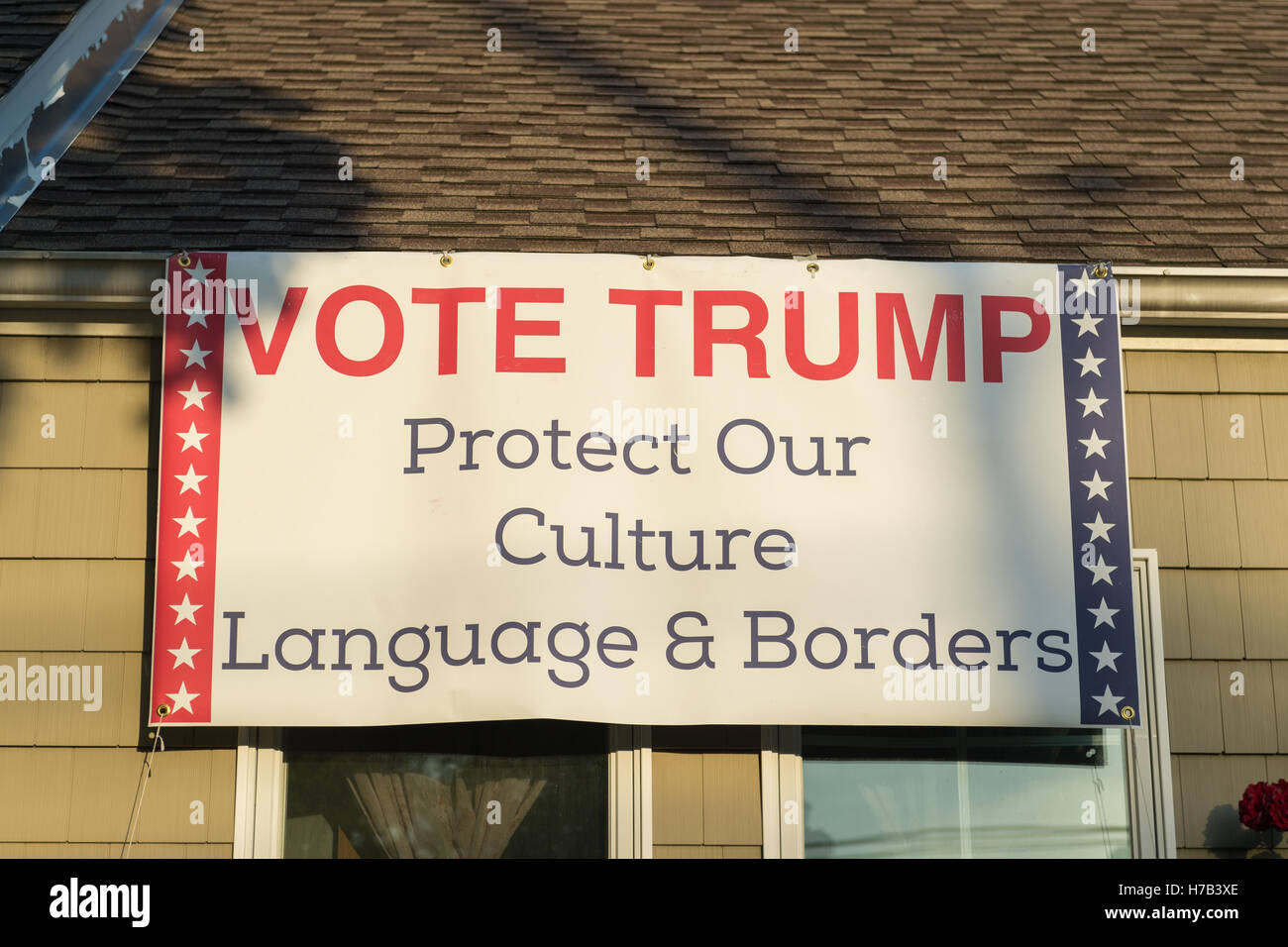 Bellmore, United States. 02nd Nov, 2016. Bellmore, New York, USA. November 2, 2016. Political banner 'VOTE TRUMP Protect Our Culture Language & Borders' supporting the nationalist Republican presidential candidate is near roof of Eileen Fuscaldo, who had a variety of pro-Trump anti-Clinton displays. Credit:  Ann E Parry/Alamy Live News Stock Photo