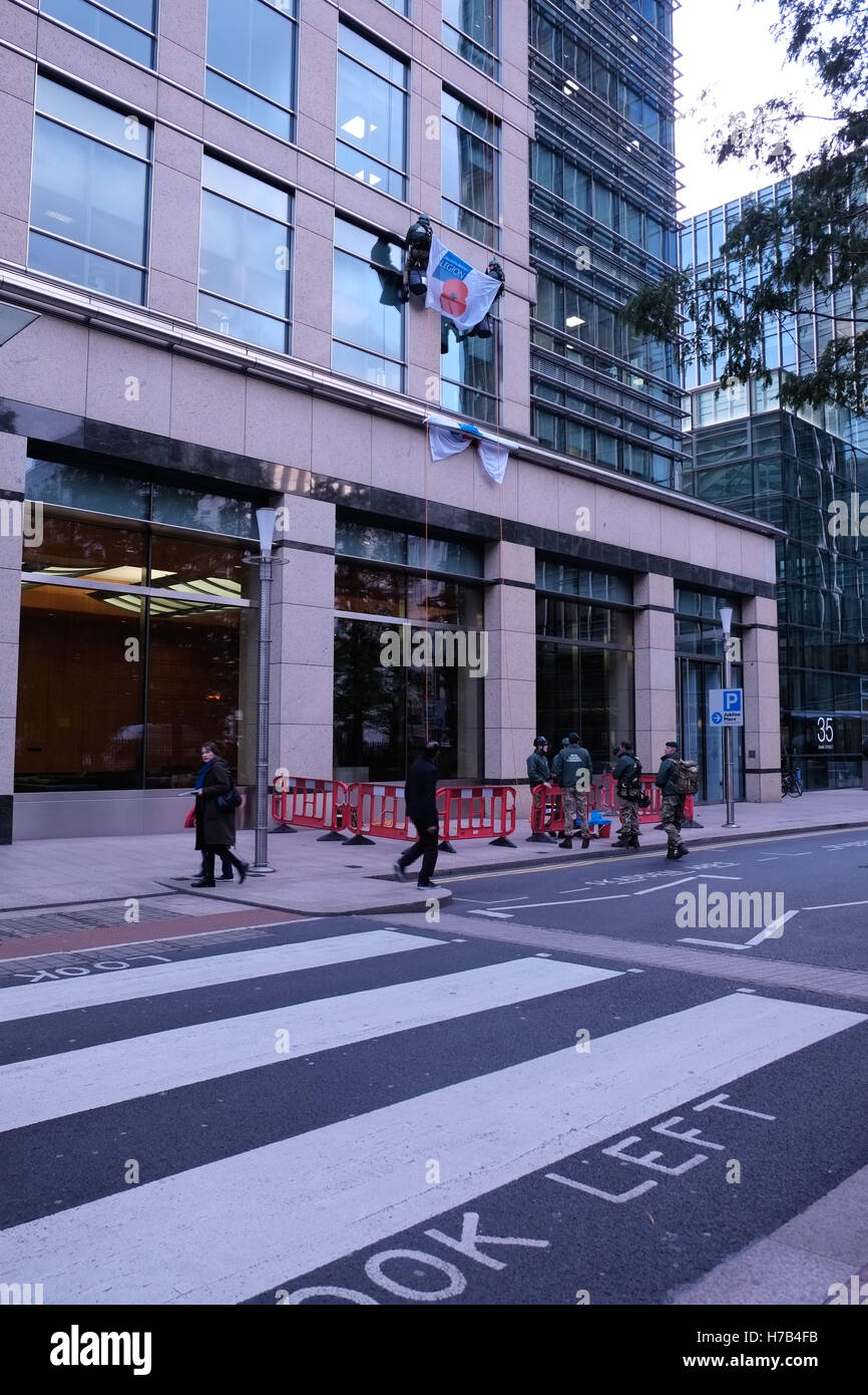 London, UK. 3rd November 2016. Royal Marine Commandos abseil down 40 Bank Street as put of The Royal British Legion's London Poppy Day street collection event. Credit:  claire doherty/Alamy Live News Stock Photo