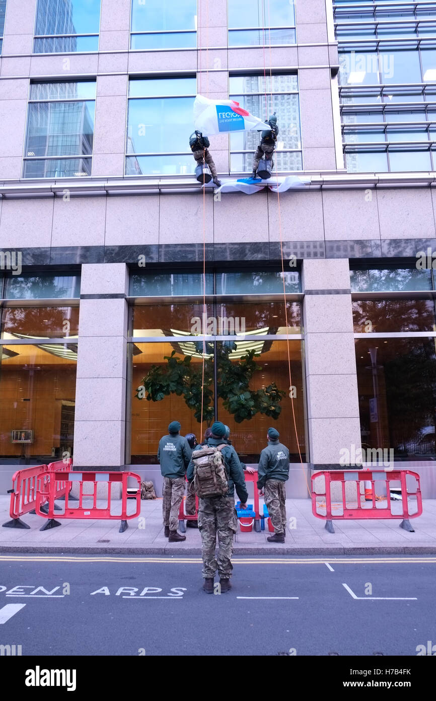 London, UK. 3rd November 2016. Royal Marine Commandos abseil down 40 Bank Street as put of The Royal British Legion's London Poppy Day street collection event. Credit:  claire doherty/Alamy Live News Stock Photo