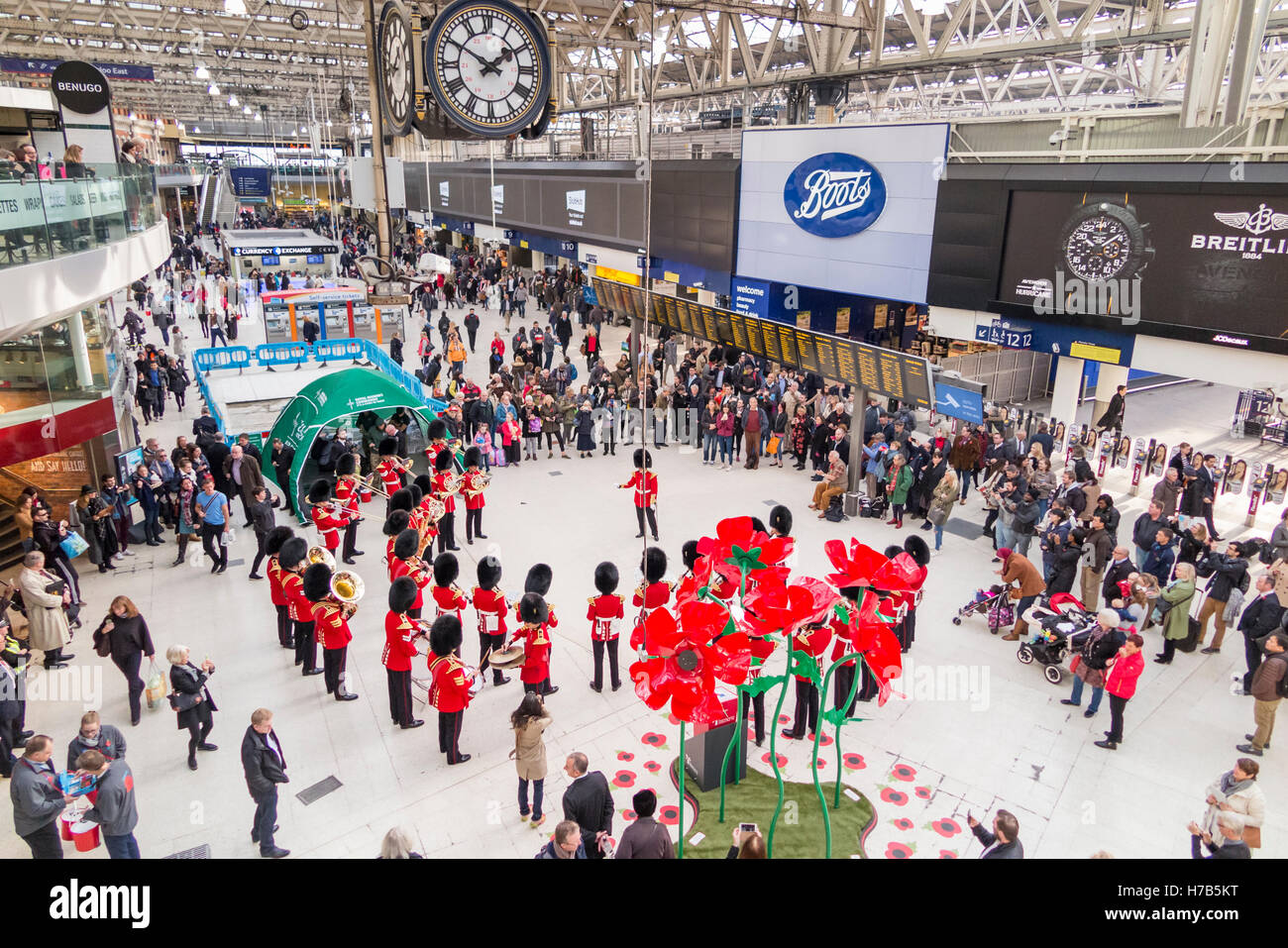 Waterloo Station, London, UK.  3rd November, 2016. The band of the Grenadier Guards performs for commuters and passengers on the concourse of Waterloo Station, London, UK. Their performance was in support of  the annual Royal British Legion Poppy Appeal. Credit:  Graham Prentice/Alamy Live News Stock Photo