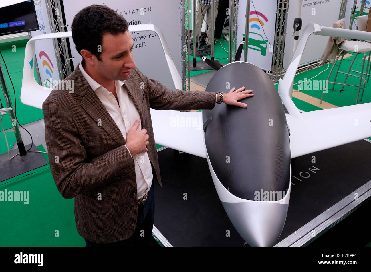 Representative of Eviation start up company display a prototype of an electric plane under development during the Fuel Choices Summit taking place in Tel Aviv on 03 November 2016. Currently there are more than 500 Israeli startups working on smart mobility and alternative fuels solutions and more than 200 research groups in universities across the country, which aspire to promote Israel's ambitious goal of reducing the country's oil consumption by 60% by 2025. Stock Photo