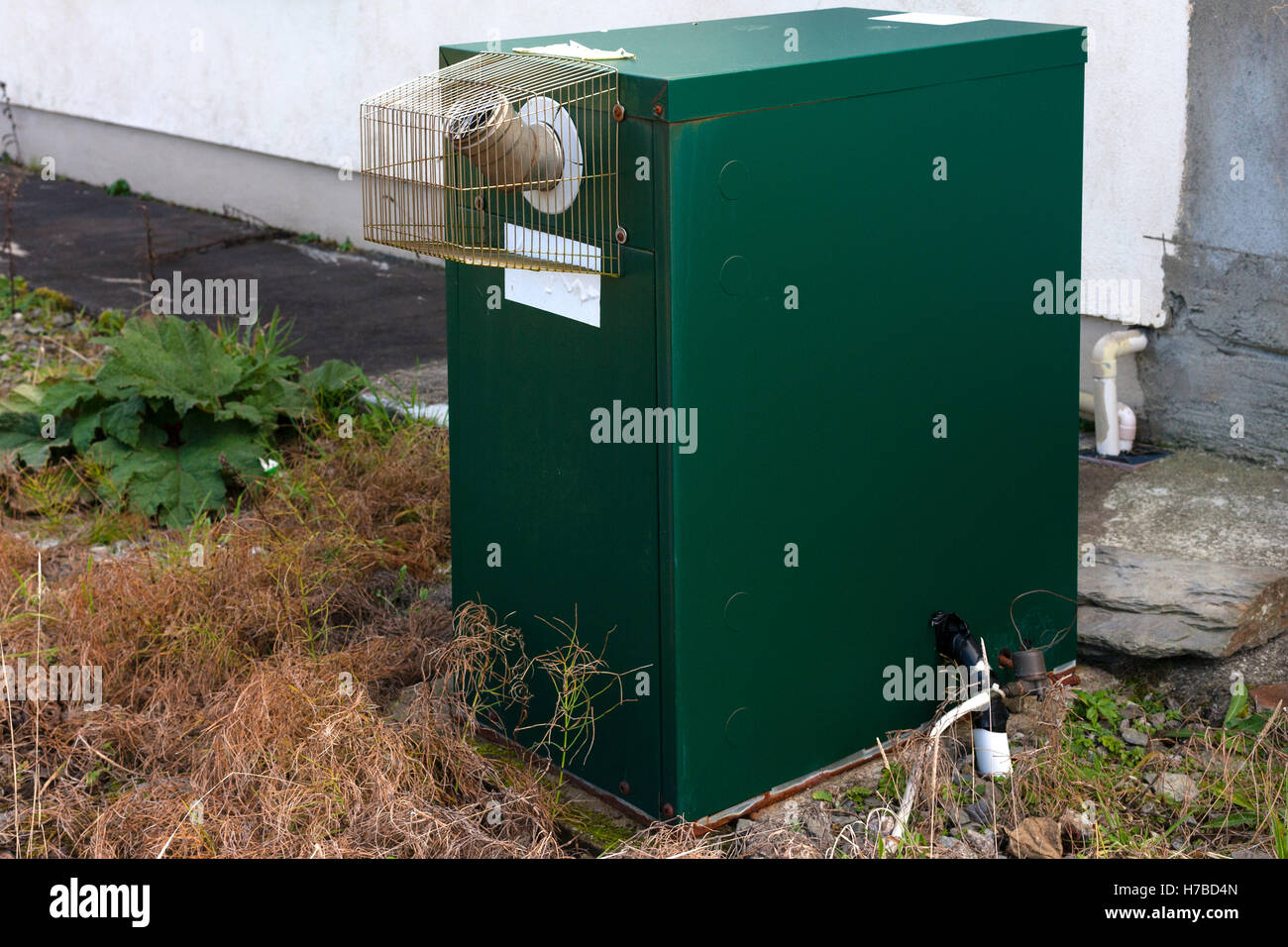 Oil Fired central heating boiler in backyard of a house, Ireland Stock Photo