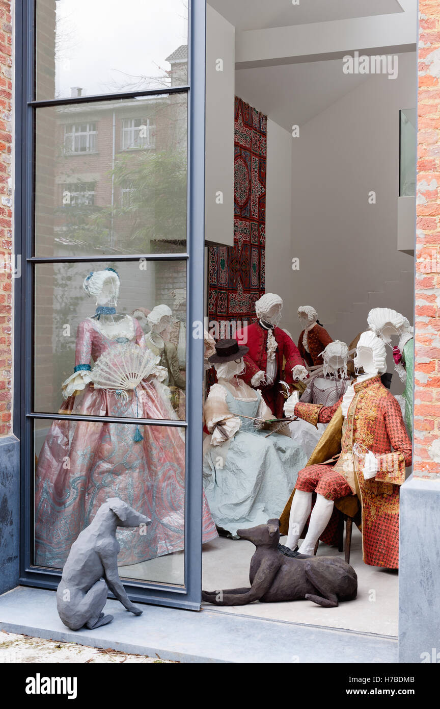 Room of wire models in historical replica paper garments at leisure, by Isabelle de Borchgrave Stock Photo