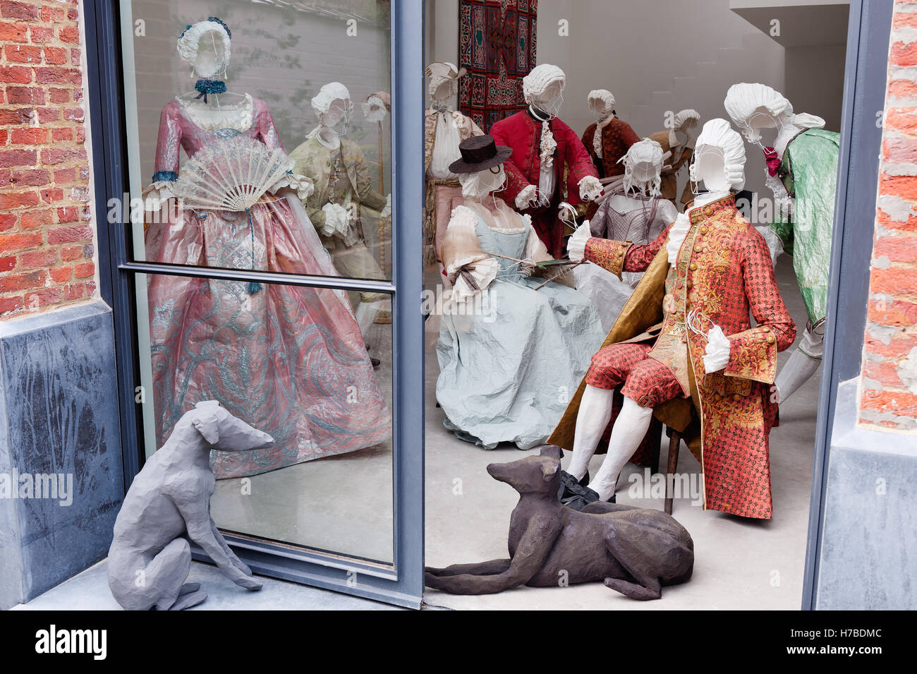 Room of wire models in historical replica paper garments at leisure, by Isabelle de Borchgrave Stock Photo