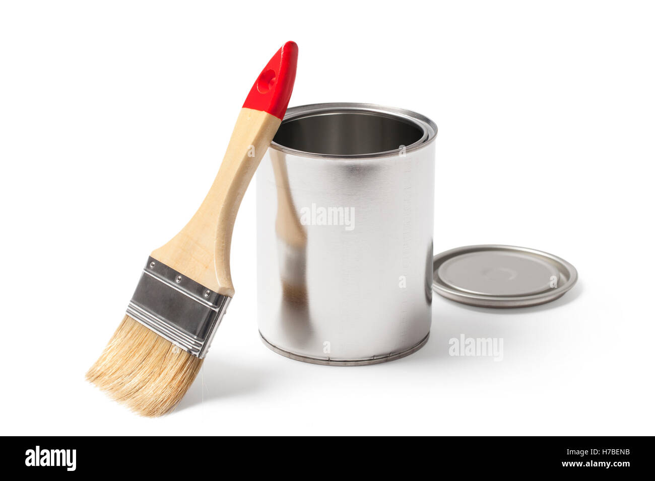 Open blank metallic paint can and a new clean paint brush with clipping path isolated on white. Stock Photo