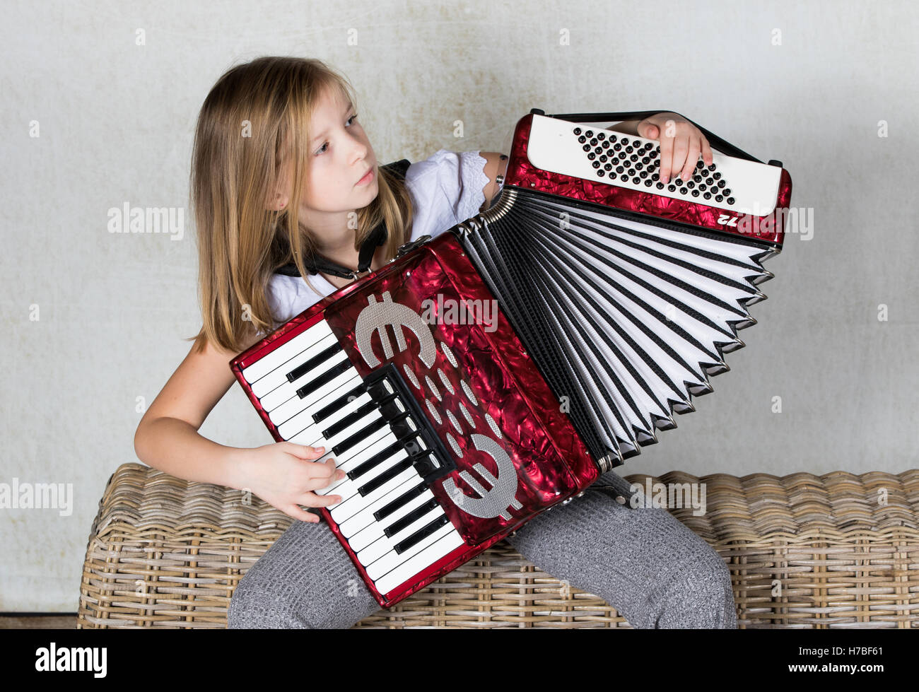 Accordionist concentration on playing her accordion Stock Photo