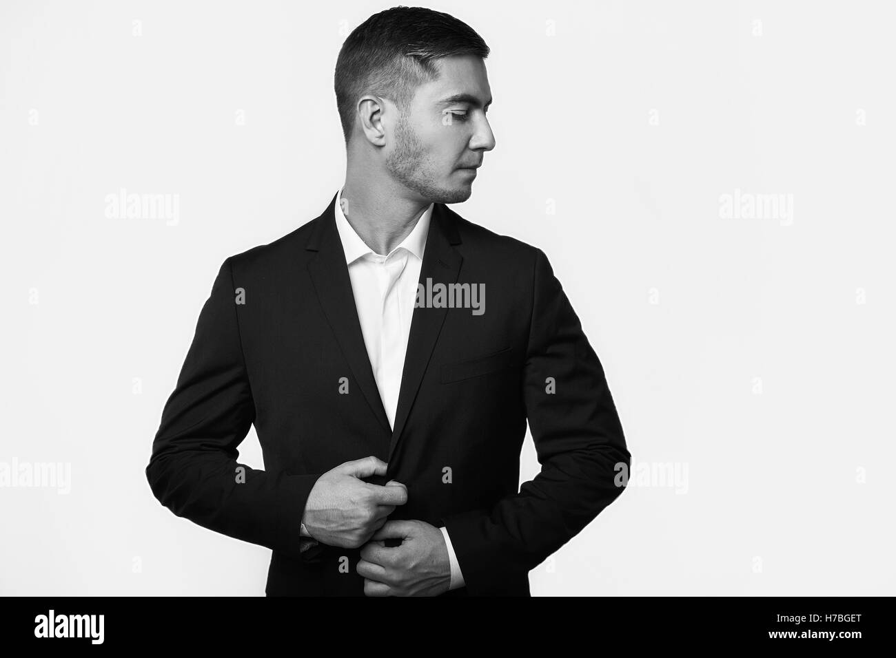 young handsome business man in suit isolated on white background in ...