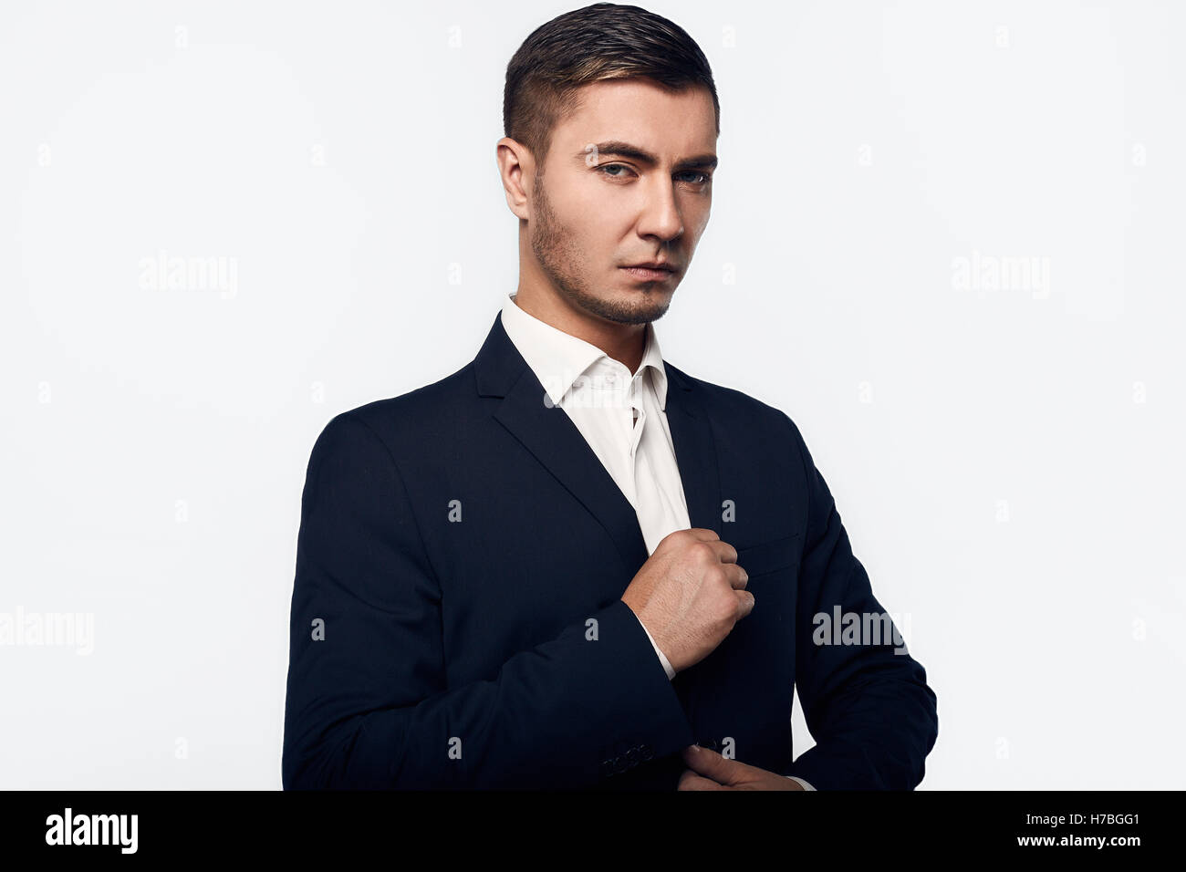 young handsome business man in suit isolated on white background in ...