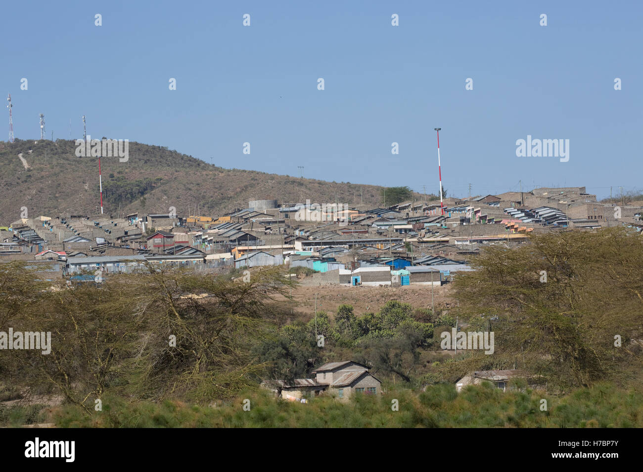 Housing development on hillside close to lake edge Lake Naivasha Kenya Stock Photo
