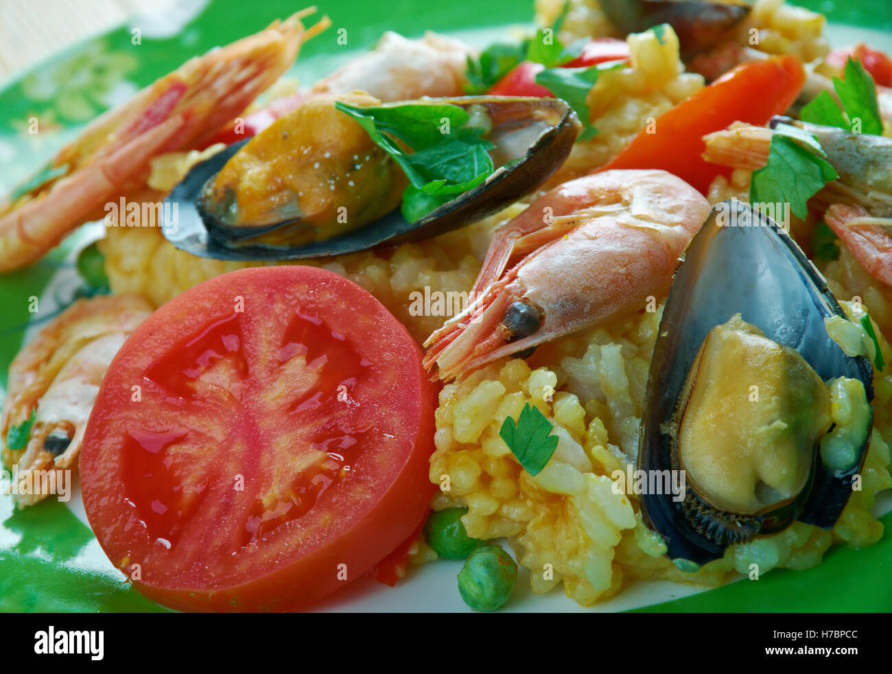 Arroz a la tumbada  traditional Mexican dish prepared with white rice and seafood. Stock Photo