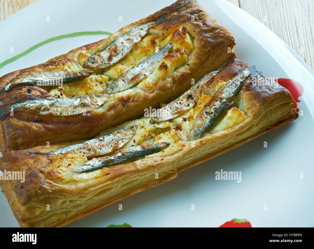 Pastry tart with anchovies. French cuisine Stock Photo