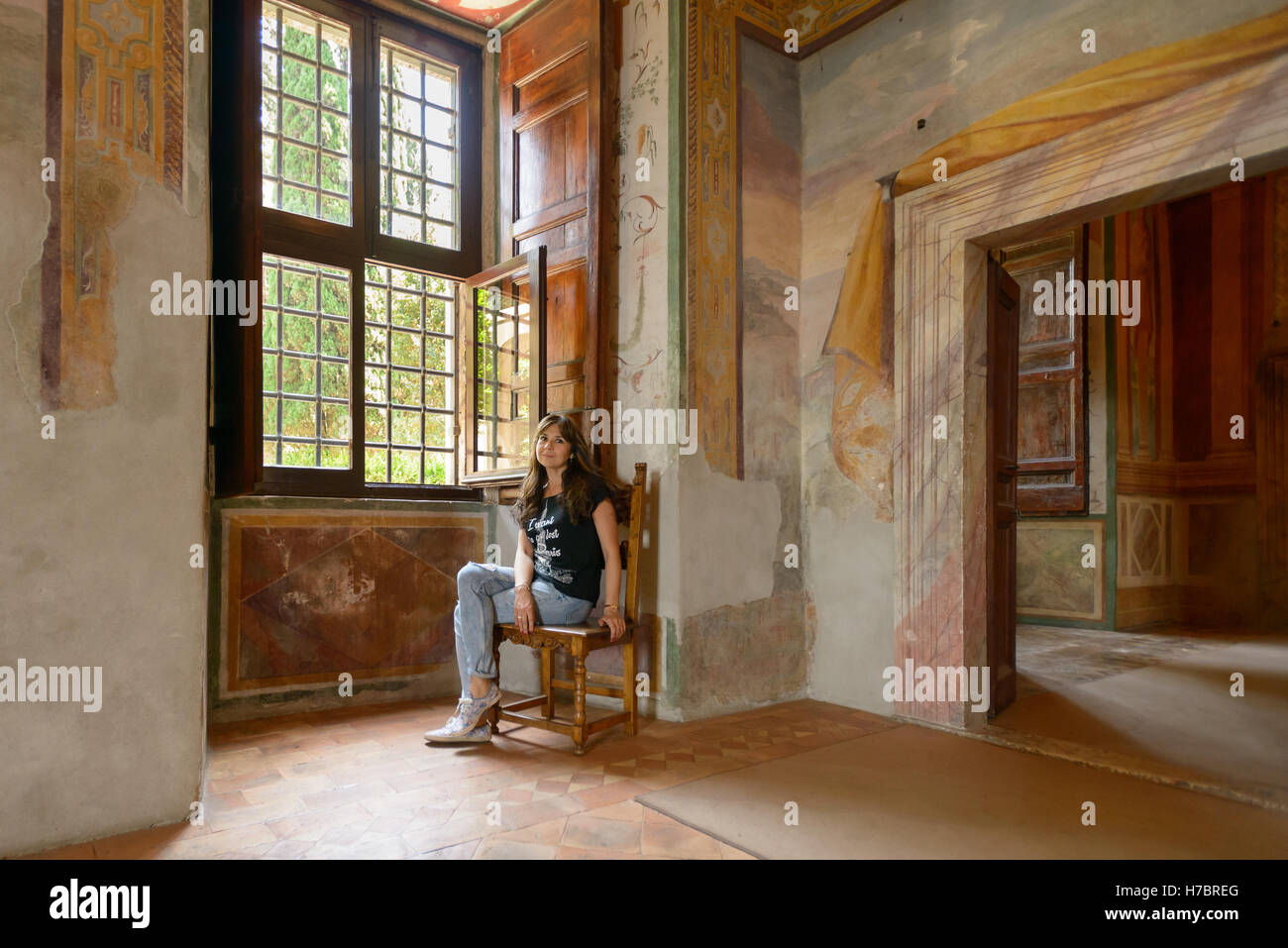 Nice girl sitting on chair hi-res stock photography and images - Alamy