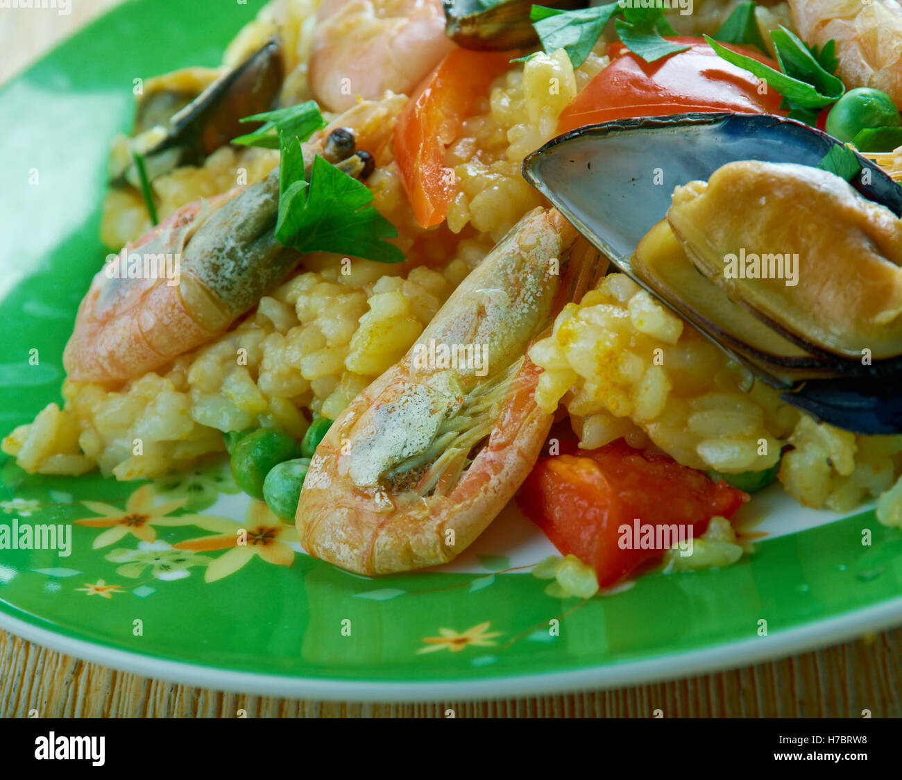 Arroz a la tumbada  traditional Mexican dish prepared with white rice and seafood. Stock Photo
