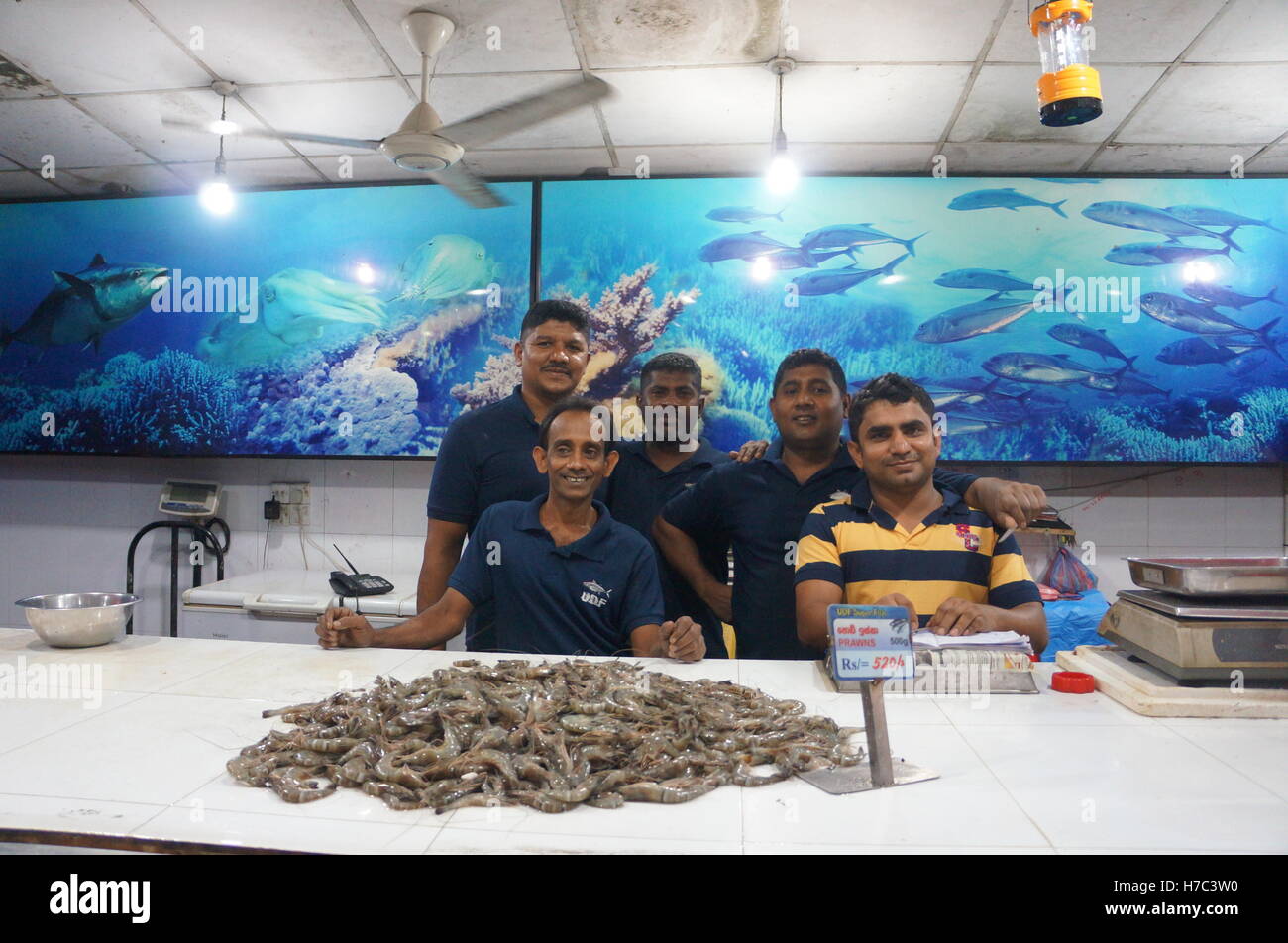The smiling staff of a seafood restaurant in Kandy, Sri Lanka. Stock Photo