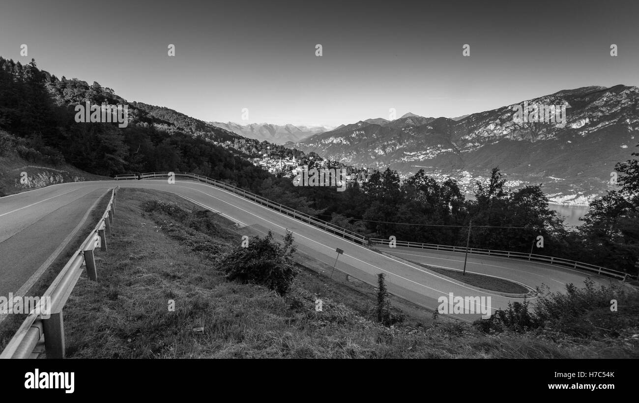 A hairpin bend on a road in the mountains near Lake Como, Italy Stock Photo