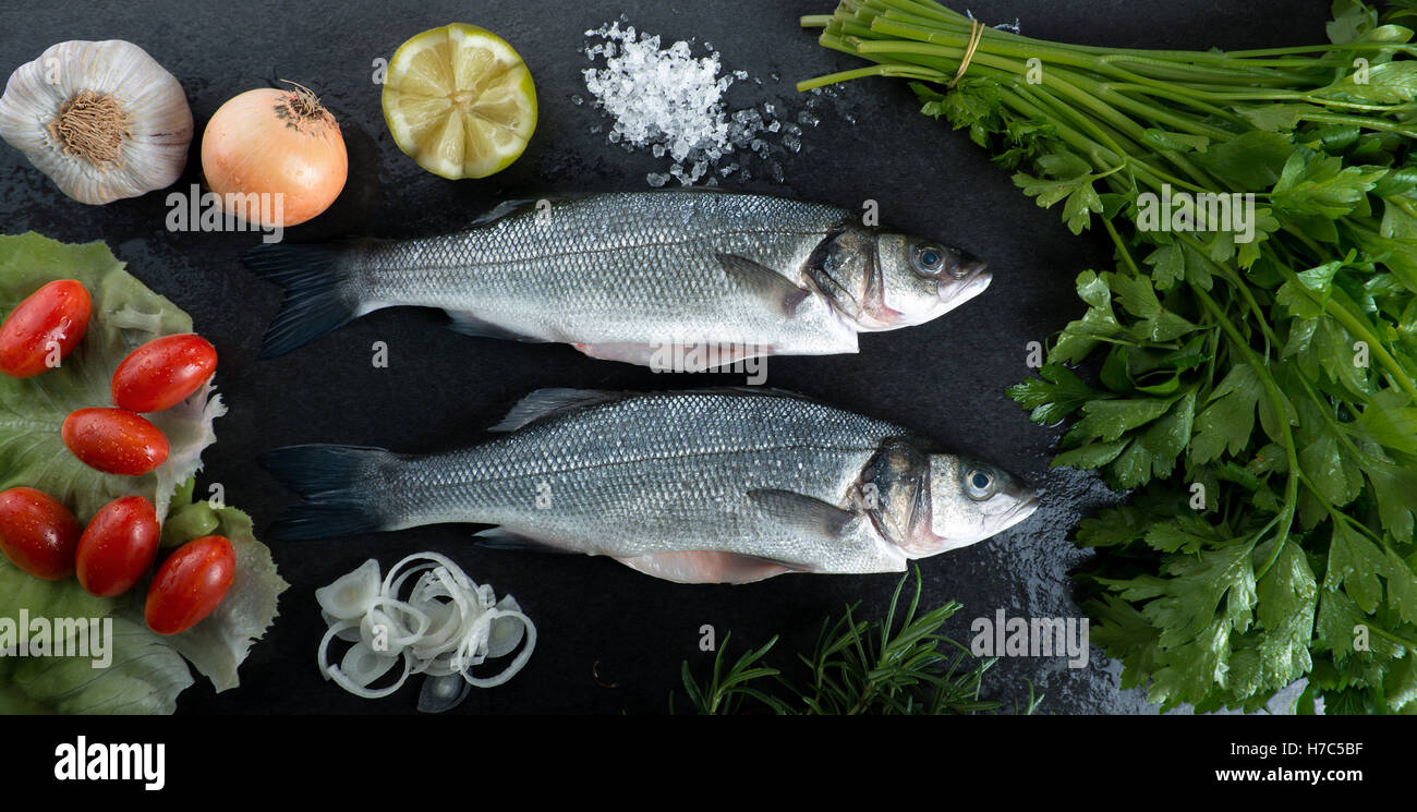 sea bass on a black background ready to cook Stock Photo