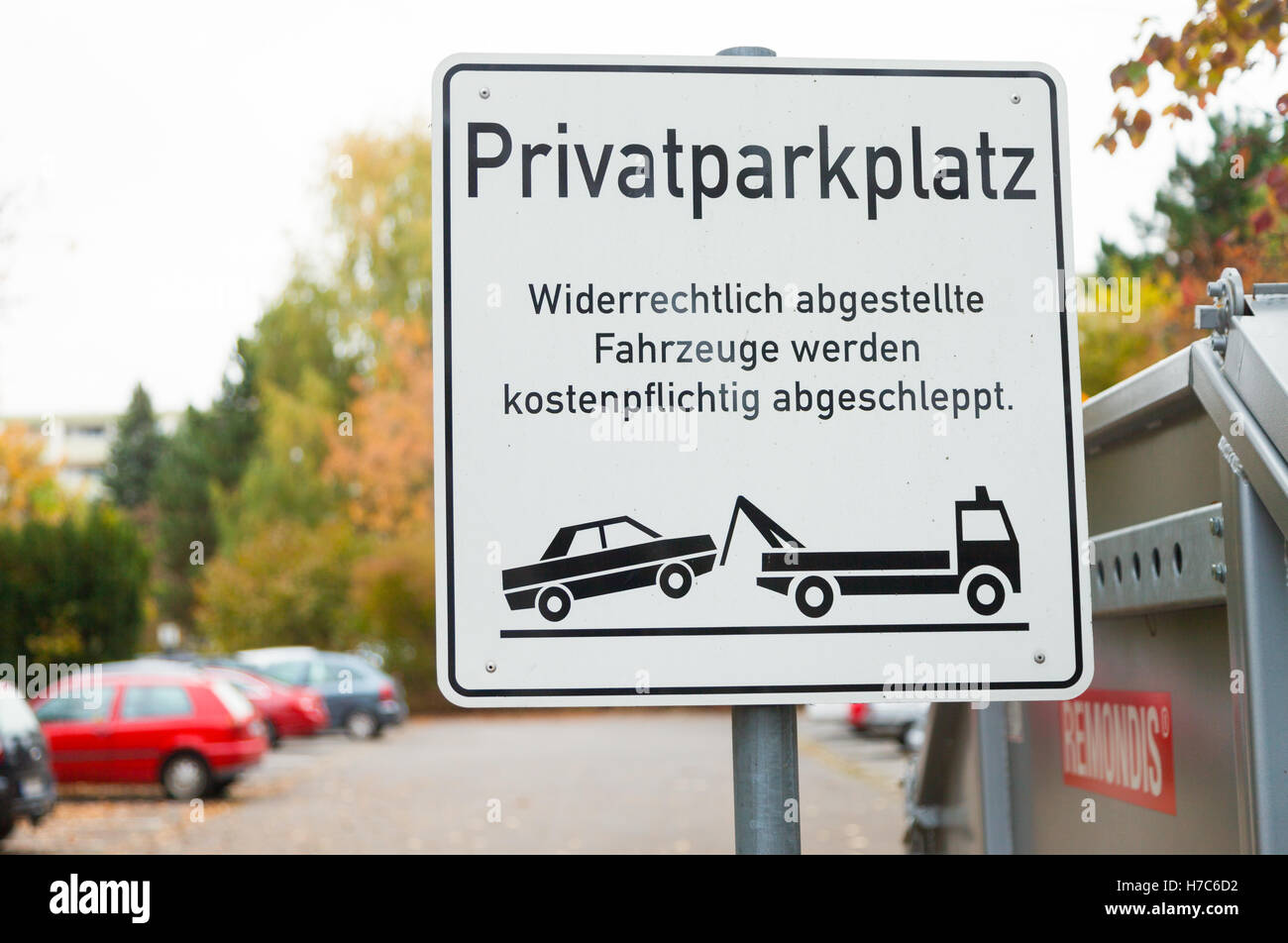 HANNOVER / GERMANY - OCTOBER 30, 2016: private parking lot sign (german: Privatparkplatz) German Text means: Unlawfully parked v Stock Photo