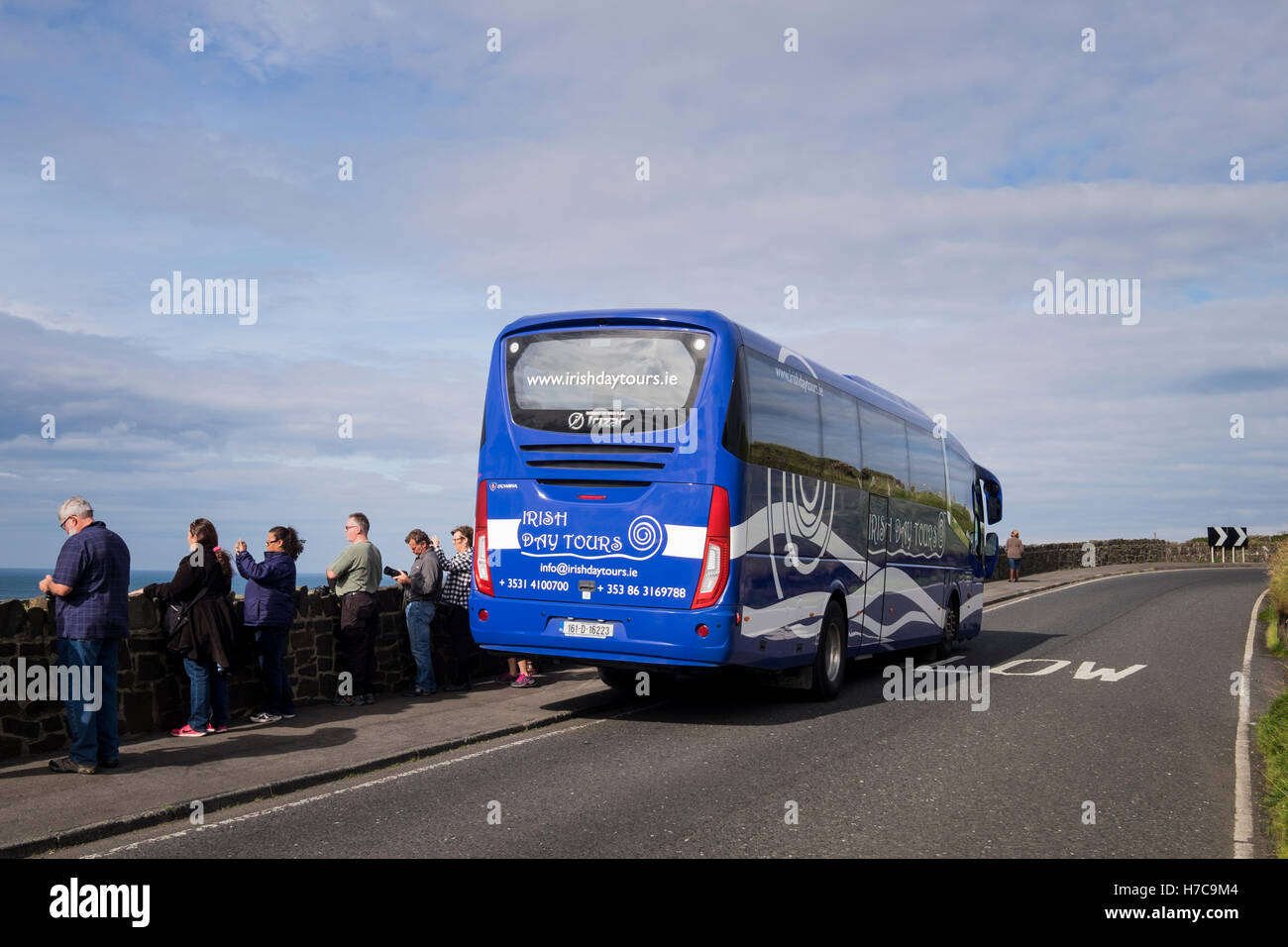 Irish Day Tours coach parked at roadside near Dunluce castle, Antrim,  Ireland Stock Photo - Alamy
