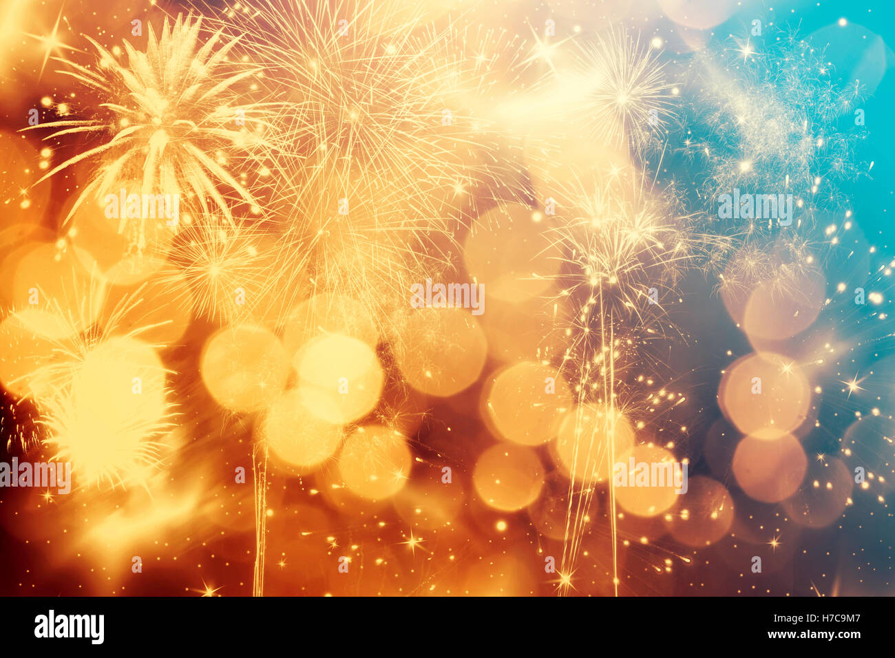 Abstract colorful holiday background of sky with fireworks and stars ...