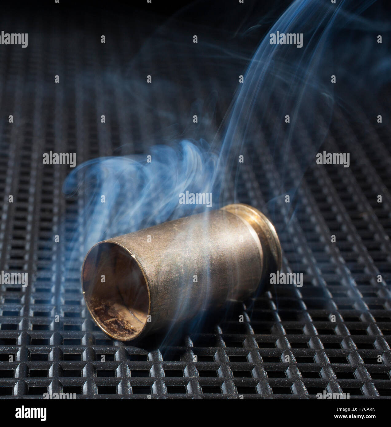 Handgun brass after a shot that is smoking Stock Photo Alamy